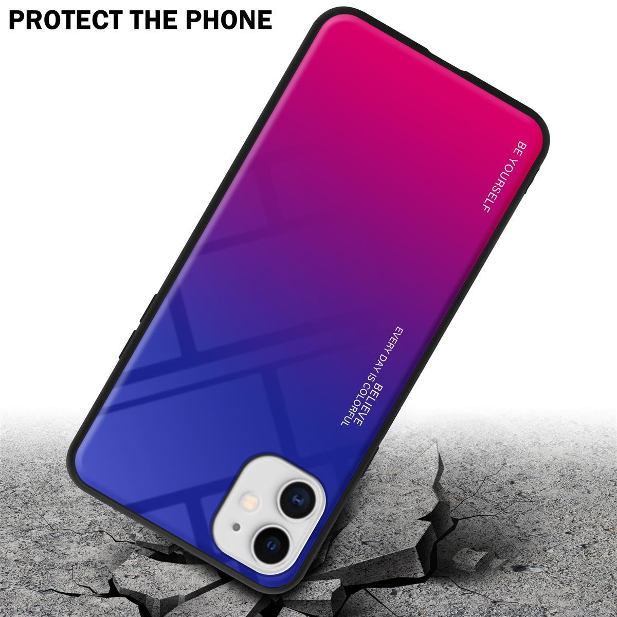 Un telefono con una custodia sfumata rossa, rosa e blu su una superficie di cemento crepata.