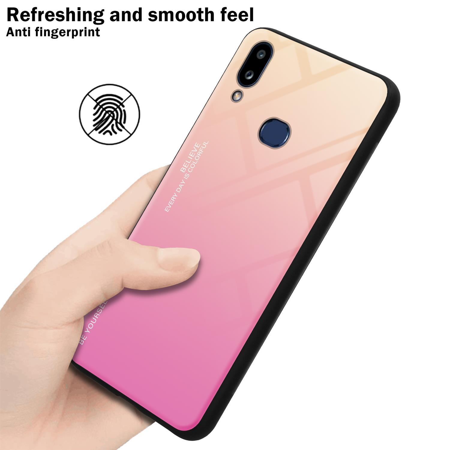 Custodia per telefono con design sfumato rosa e giallo, tenuta in mano. Icona impronta digitale e testo visibili.
