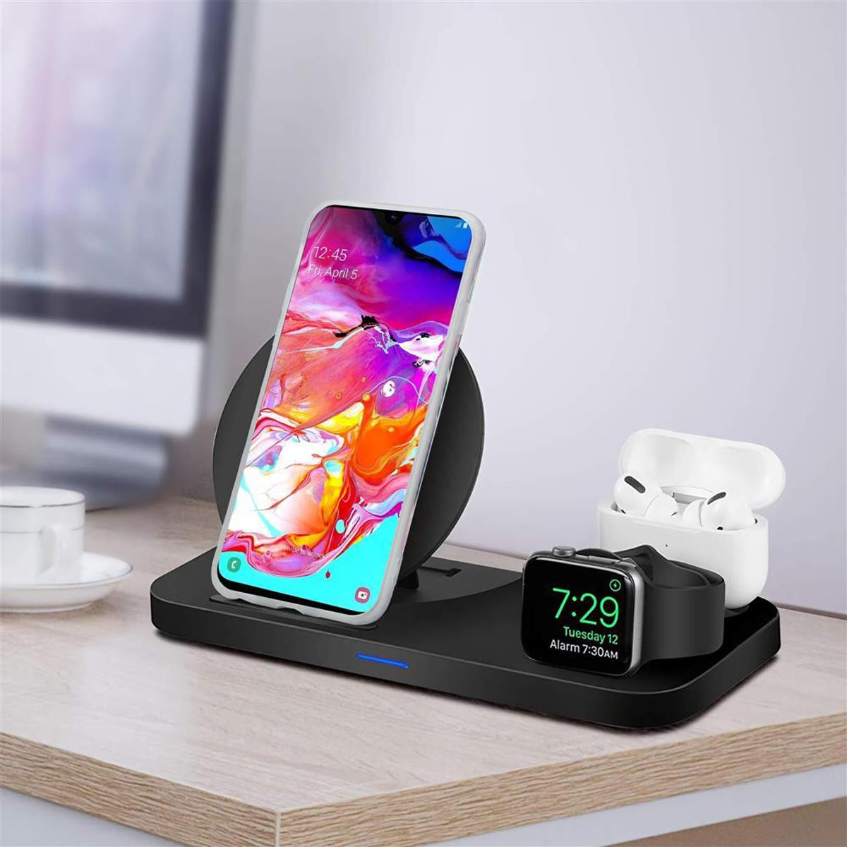 Stazione di ricarica nera con telefono, orologio e auricolari. Il telefono mostra un'immagine colorata.