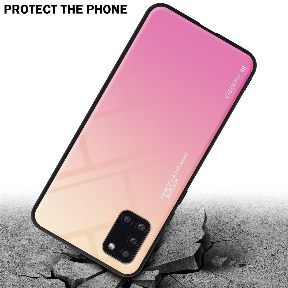 Rosa und gelbe Handyhülle auf einer zerbrochenen Oberfläche. Das Telefon ist abgewinkelt.