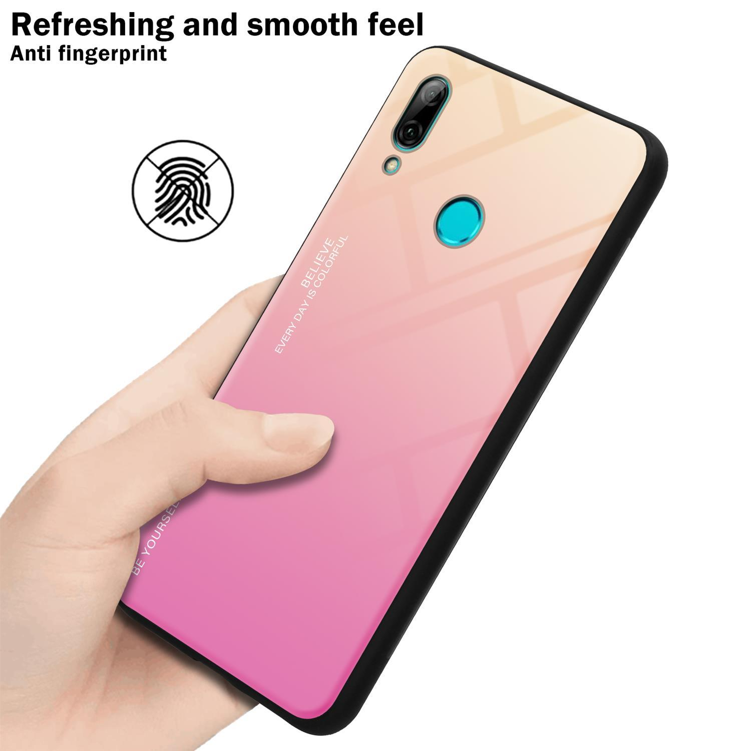 Eine Person hält ein Telefon mit einer Gradientenhülle. Die Hülle hat einen rosa und gelben Farbverlauf.