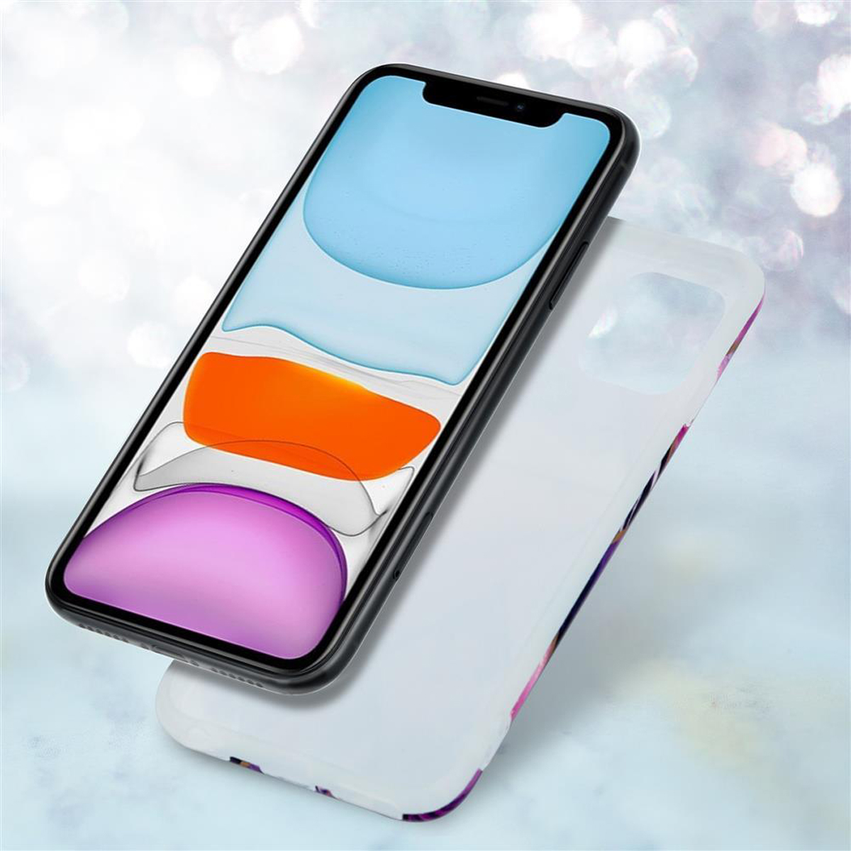 Telefono e custodia fluttuanti in aria. Il telefono ha uno schermo arancione e rosa. La custodia è bianca con dettagli colorati.