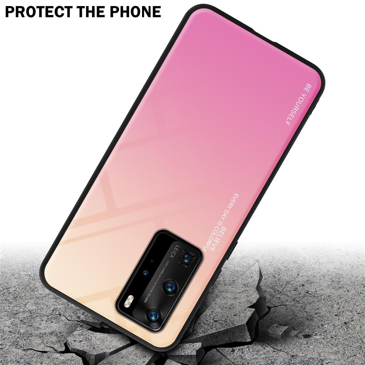 Telefono con custodia sfumata rosa e gialla. Terreno in cemento sotto il telefono.