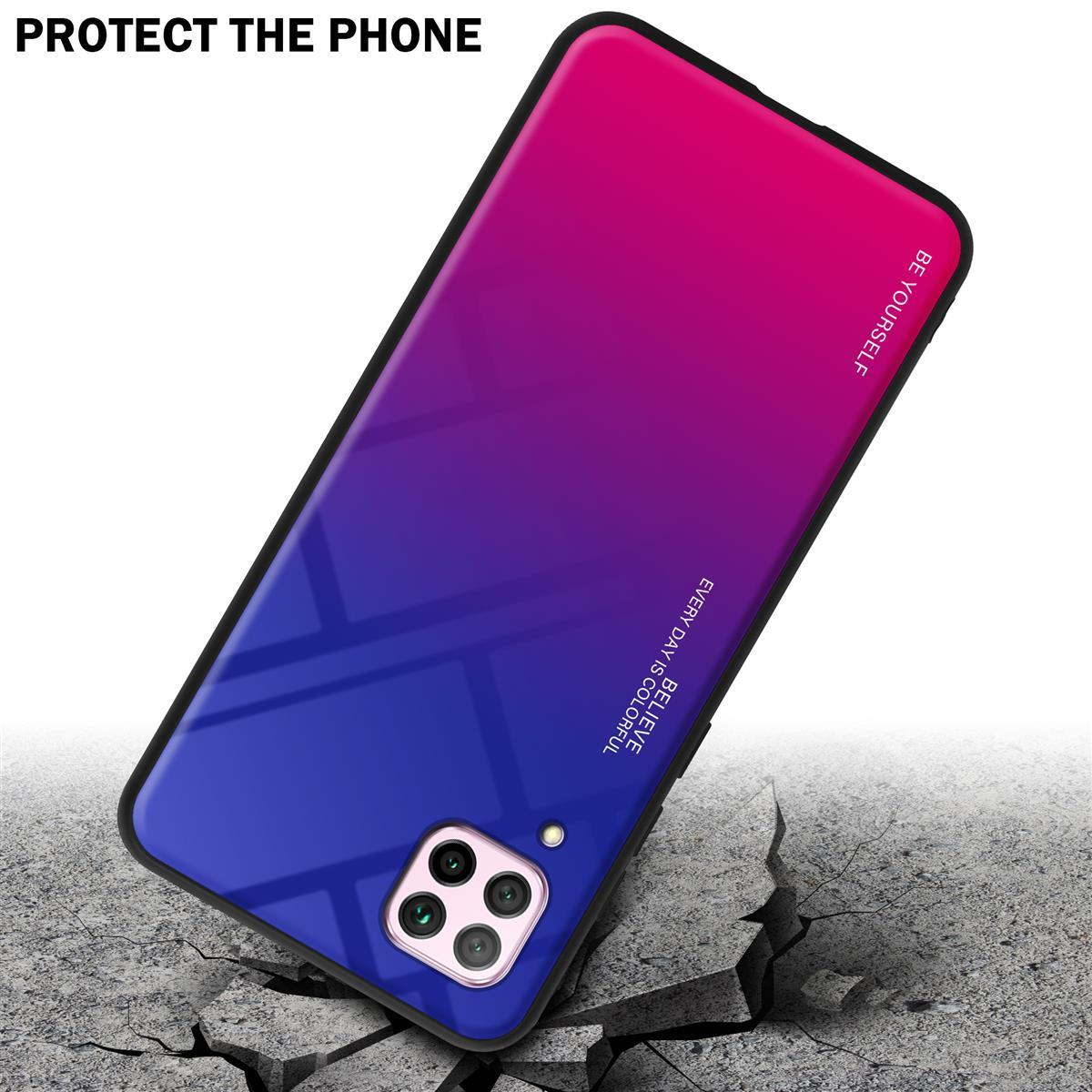 Una custodia per telefono con un gradiente da blu a viola cade su un pavimento di cemento rotto. La fotocamera è visibile.