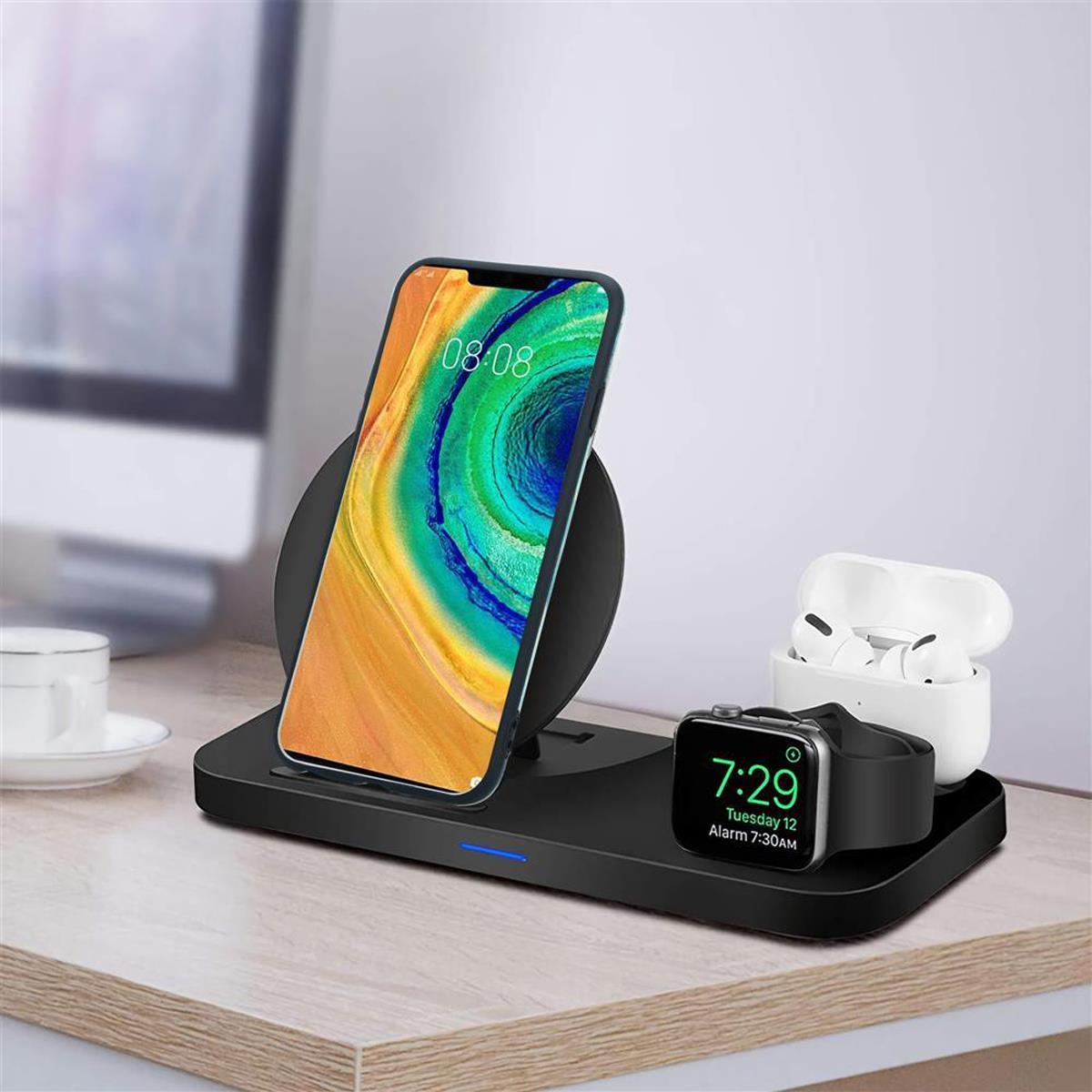 Un telefono si sta caricando su un caricabatterie wireless con un orologio e auricolari sul lato.