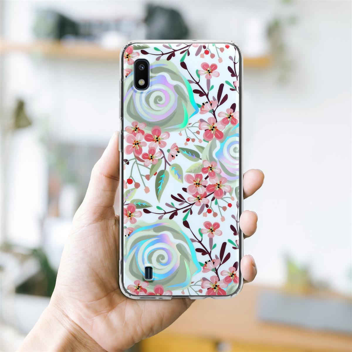 Mano che tiene un telefono con custodia dal design floreale.