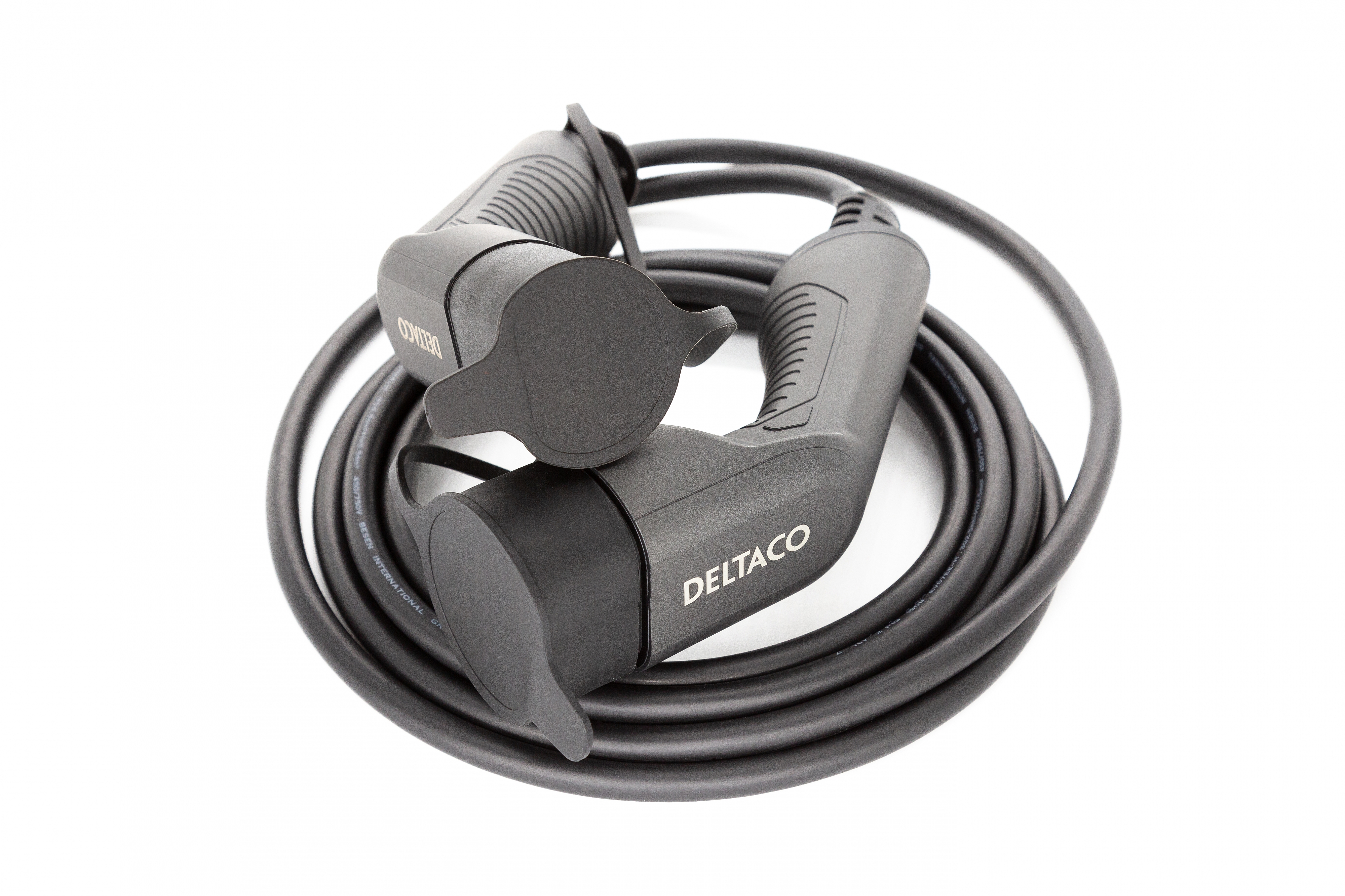 Black charger cables, with two Deltaco plugs, coiled on a white surface.