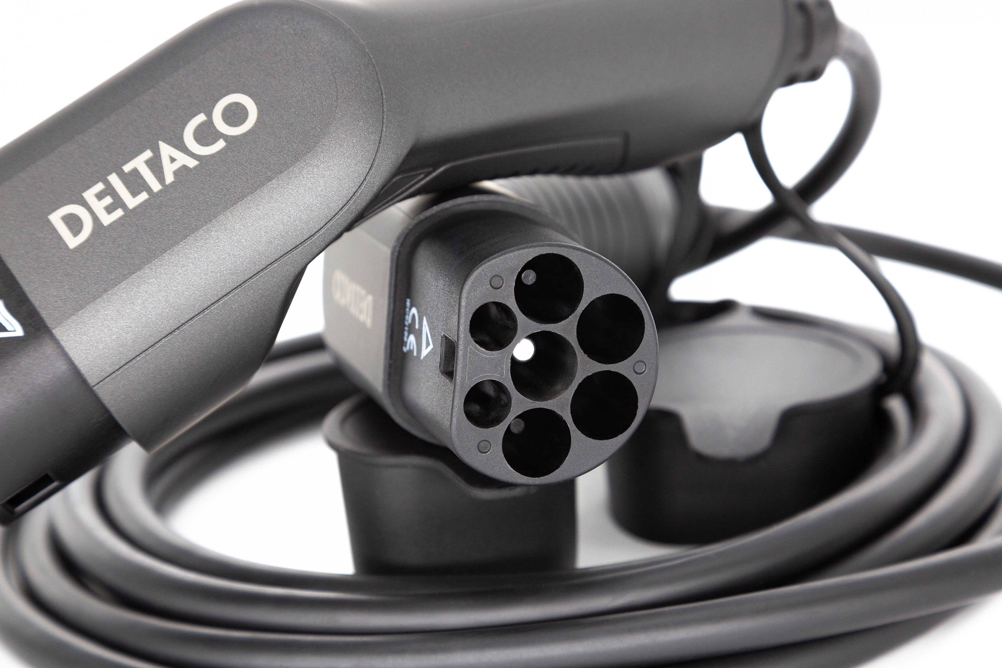 Black electric car charger with 'DELTACO' text, white background. Close-up shot.