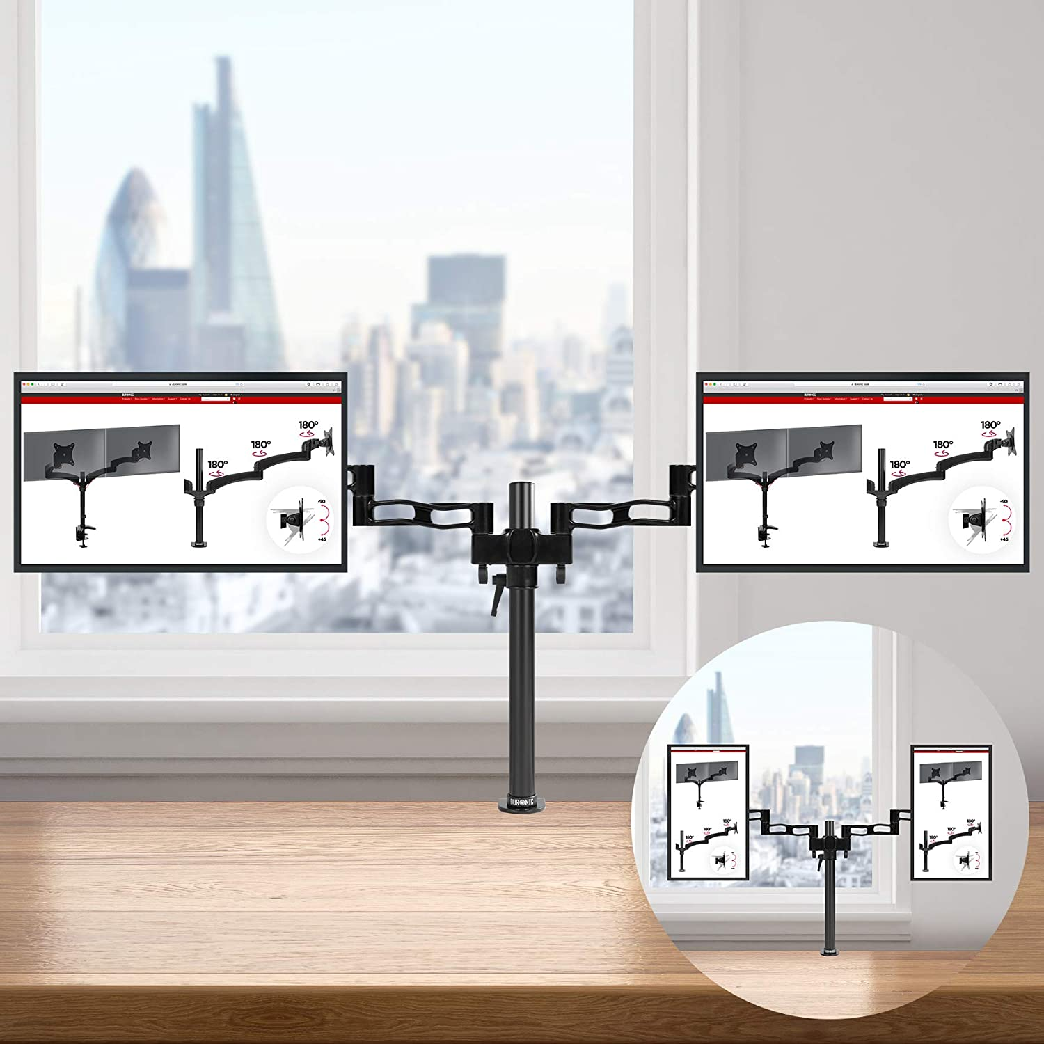 Ein Schreibtisch mit zwei Monitoren an Armen, in der Nähe eines Fensters. Die Monitore zeigen ein Diagramm.