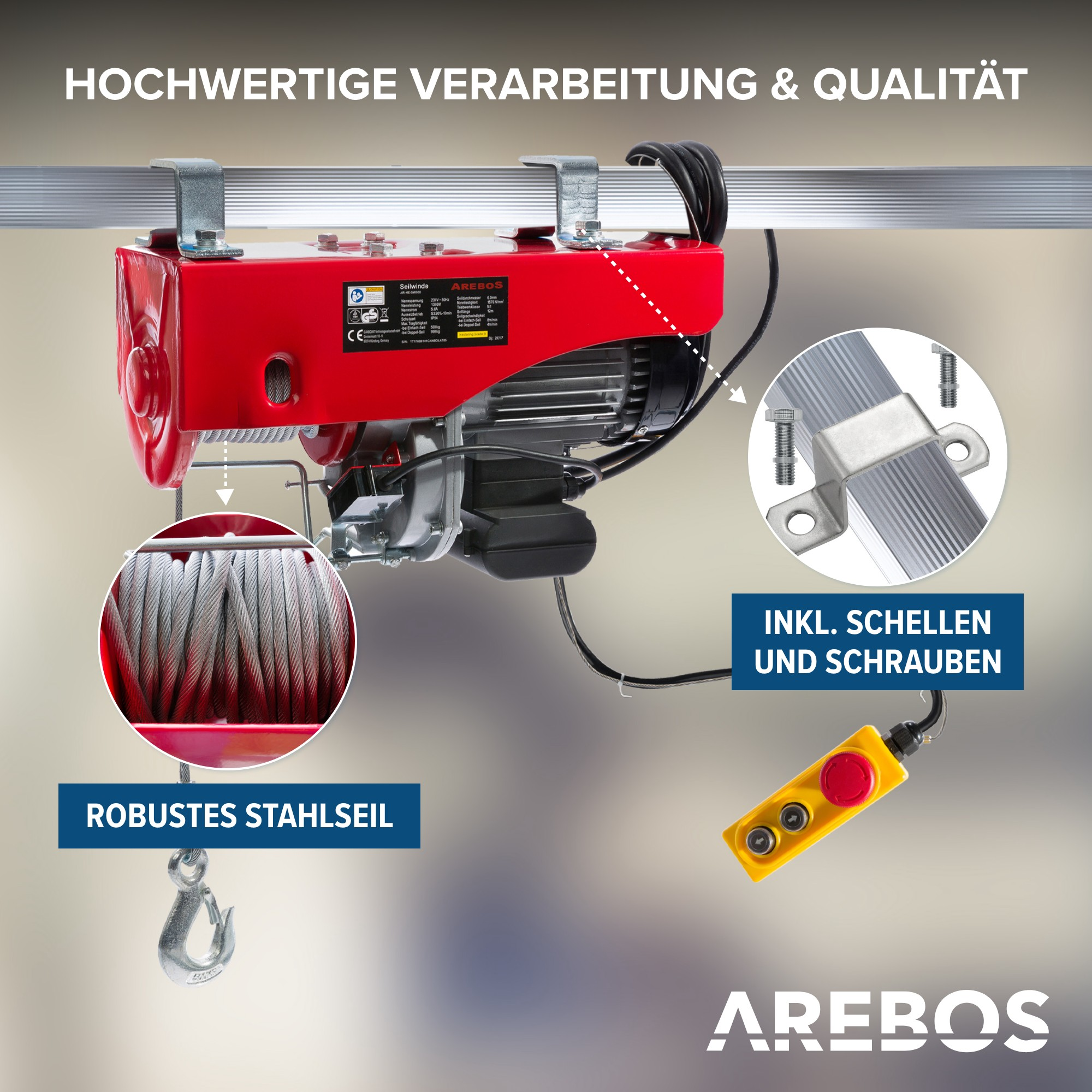 Ein roter Hebezug mit Stahlseil, gelber Fernbedienung und Anweisungen.