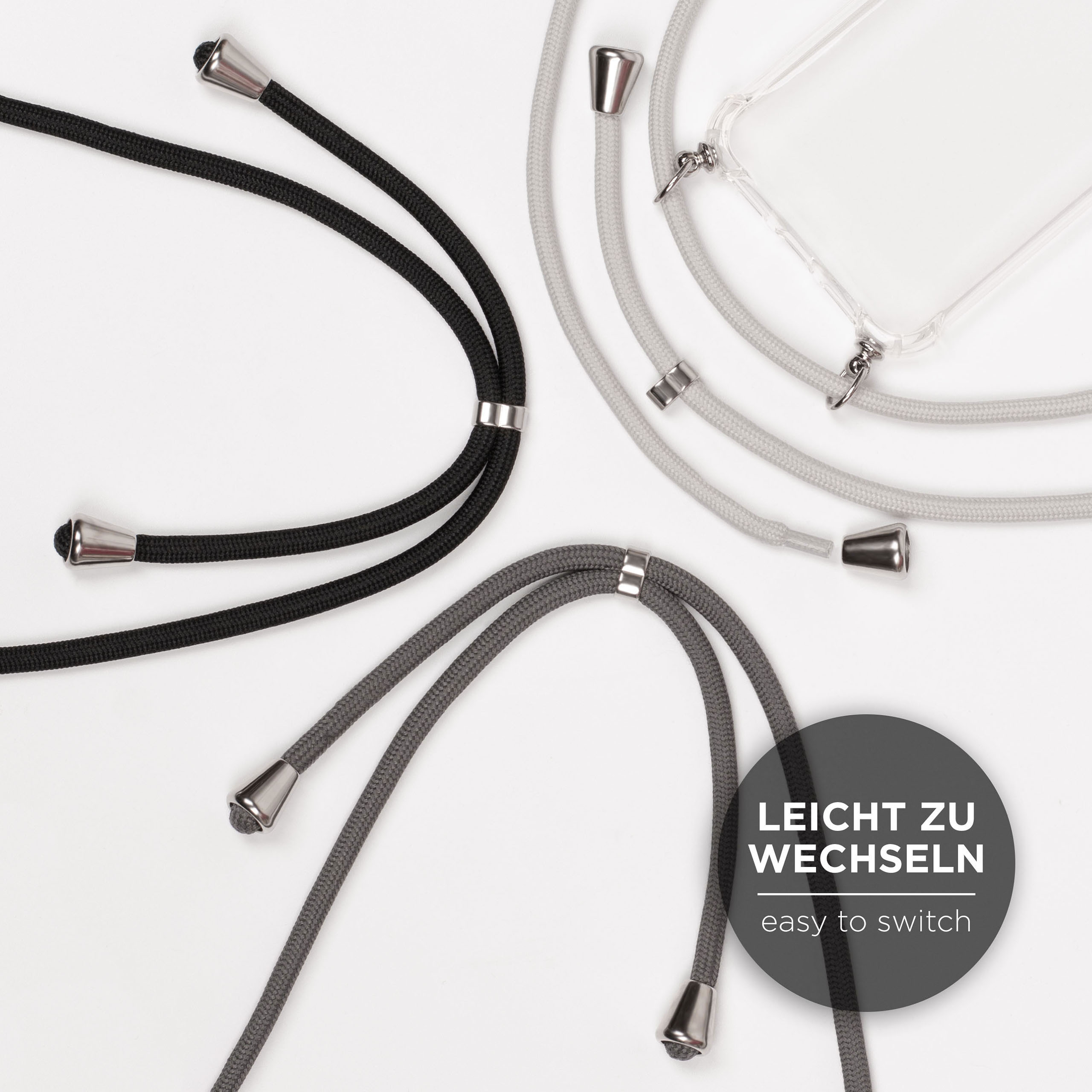 Vier Handy-Lanyards in Schwarz, Grau und Transparent. Text: Einfach zu wechseln.