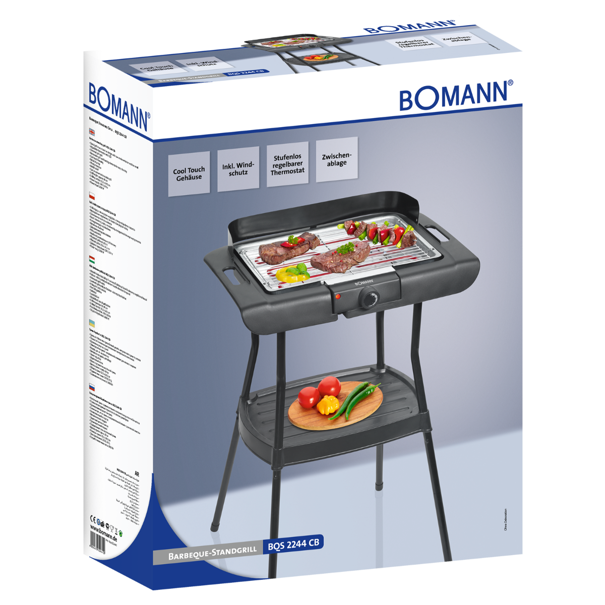 Czarny grill elektryczny z jedzeniem i opakowaniem. Grill ma czarny stół.