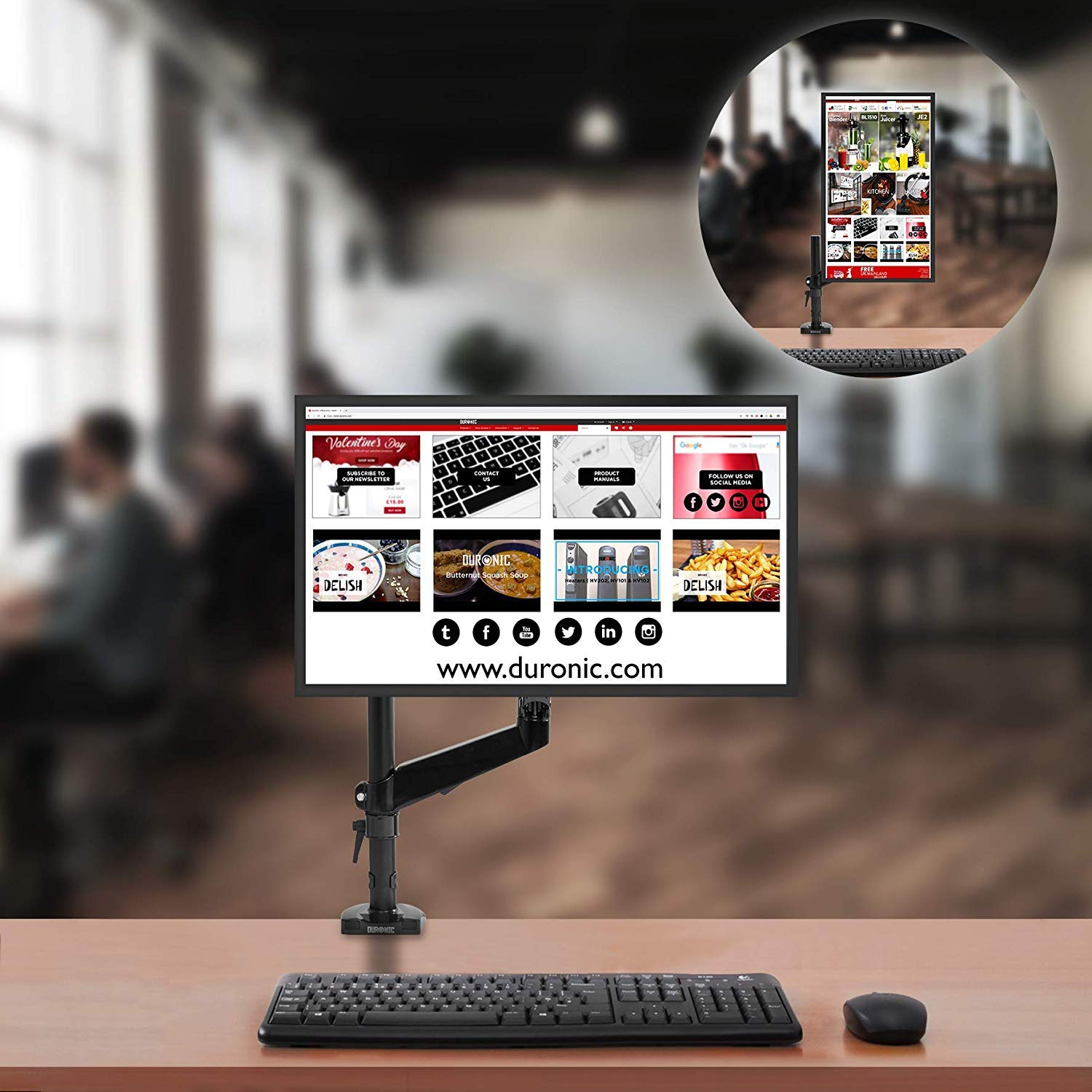 Computermonitor auf einem Schreibtisch mit Tastatur und Maus. Ein kleinerer Monitor im Hintergrund.