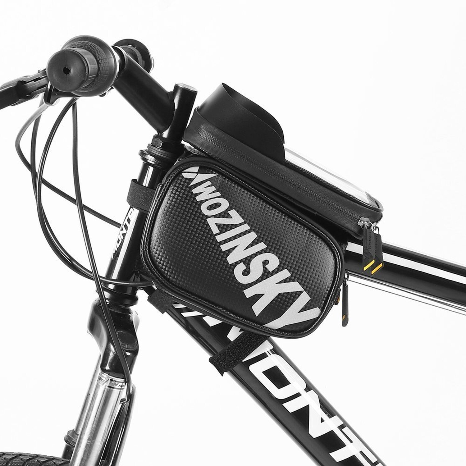 Eine schwarze Fahrradtasche, die an den Lenkern eines Fahrrads befestigt ist.