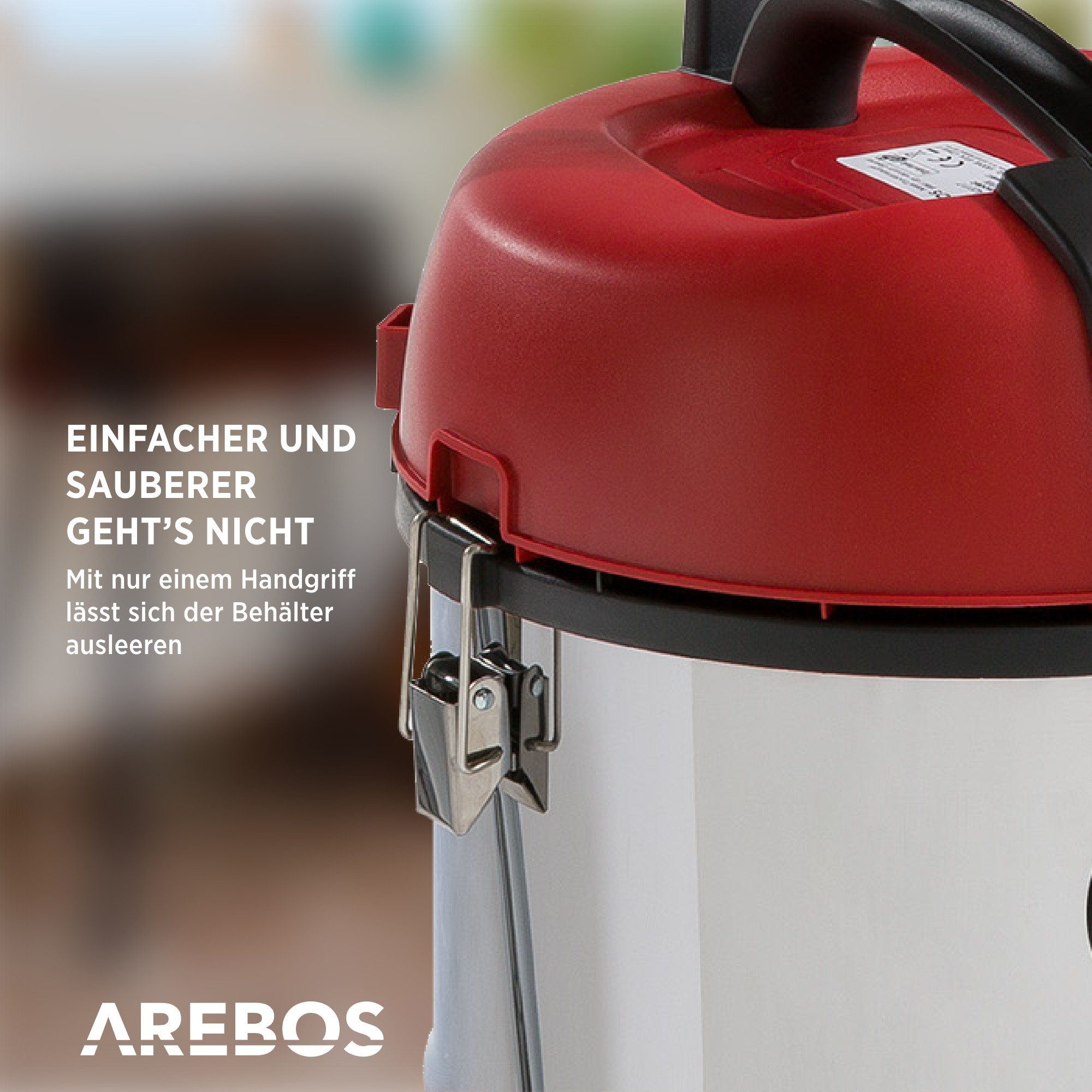 Ein roter und silberner Staubsauger mit deutschem Text.