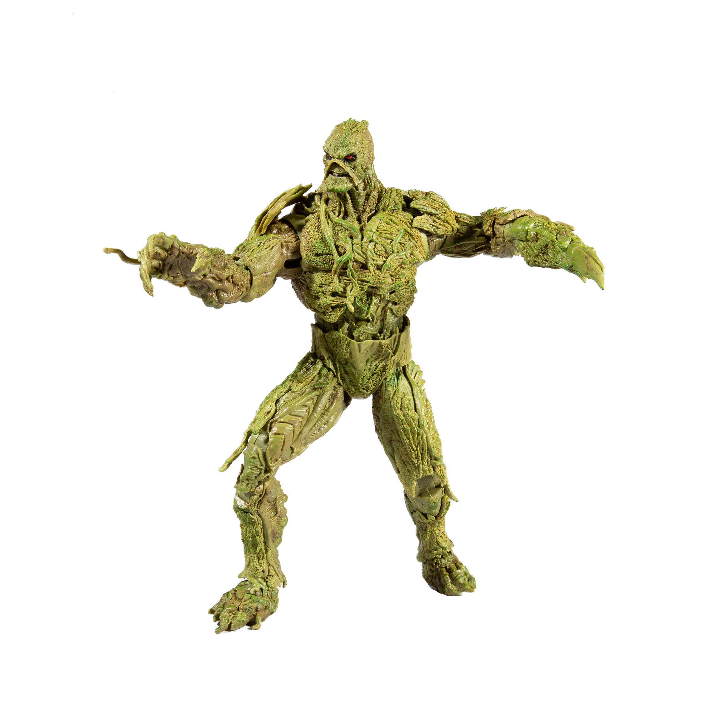 Swamp Thing-Actionfigur. Die Figur ist grün und sieht aus wie ein pflanzenartiger Humanoider. Er hat ausgestreckte Arme.