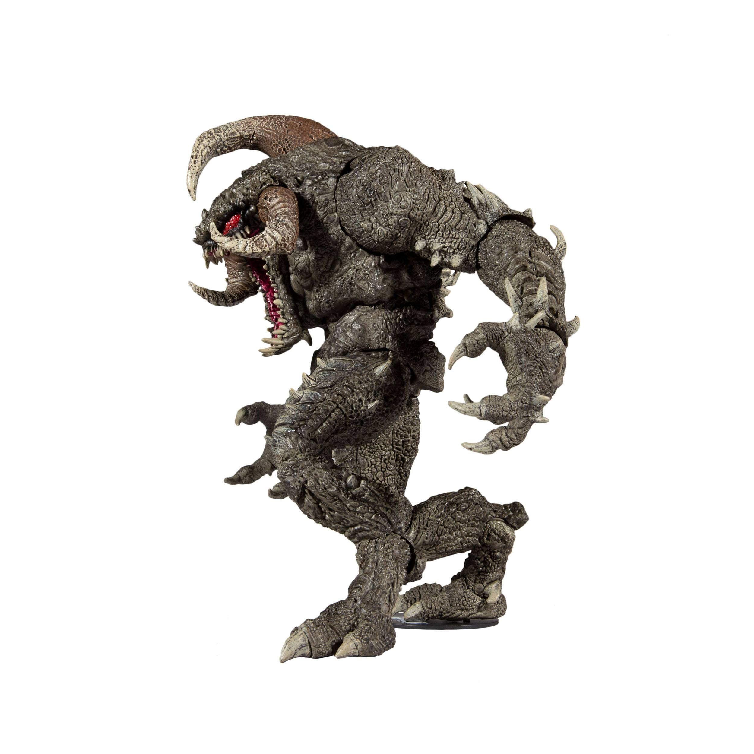 Eine große Monster-Actionfigur in einer dynamischen Pose mit Hörnern und Krallen.