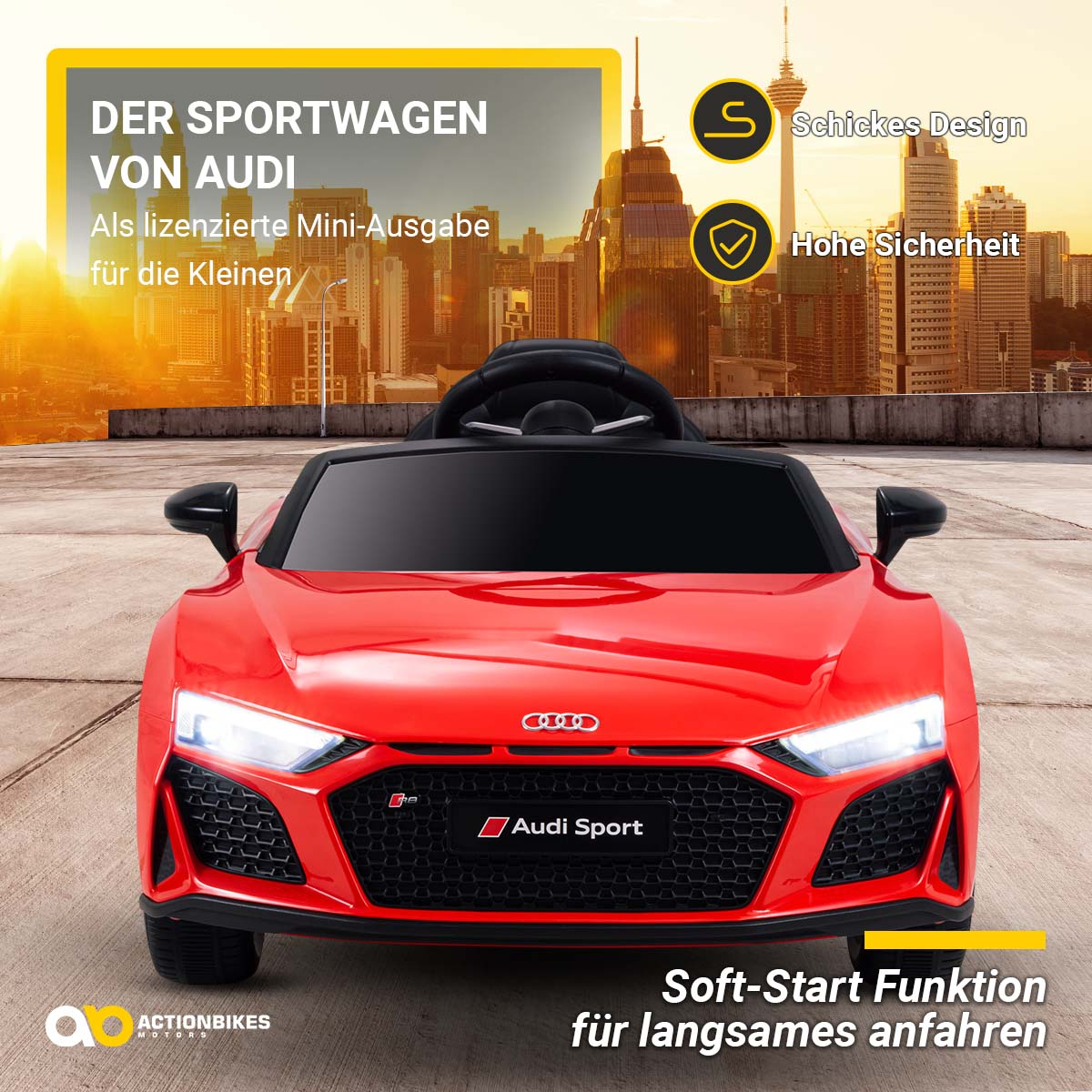 Ein rotes Spielzeug-Audi-Auto mit Schrift und Grafiken vor einer Skyline.