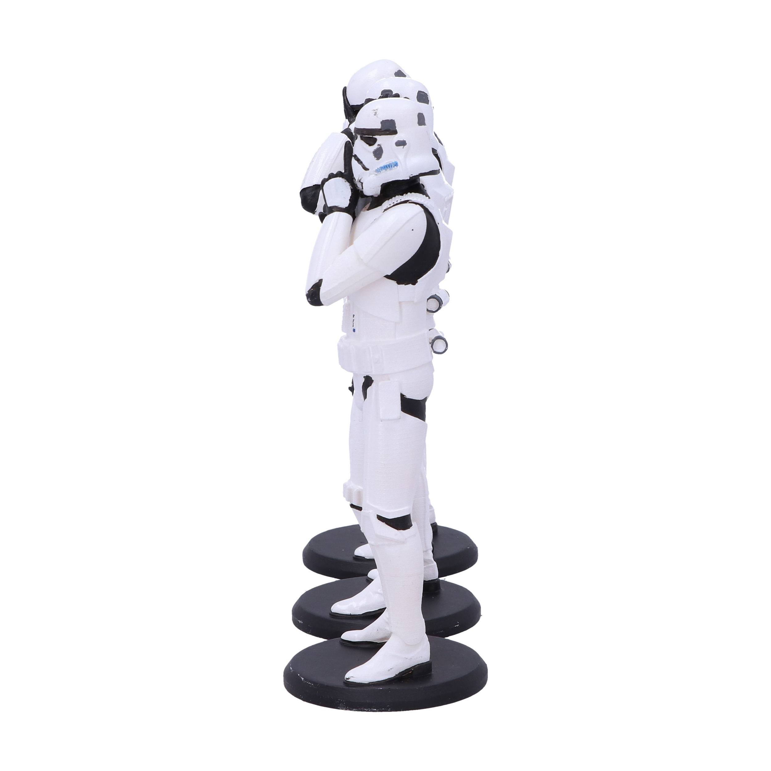 Drei weiße Stormtrooper-Figuren stehen auf schwarzen kreisförmigen Sockeln, Seitenansicht.