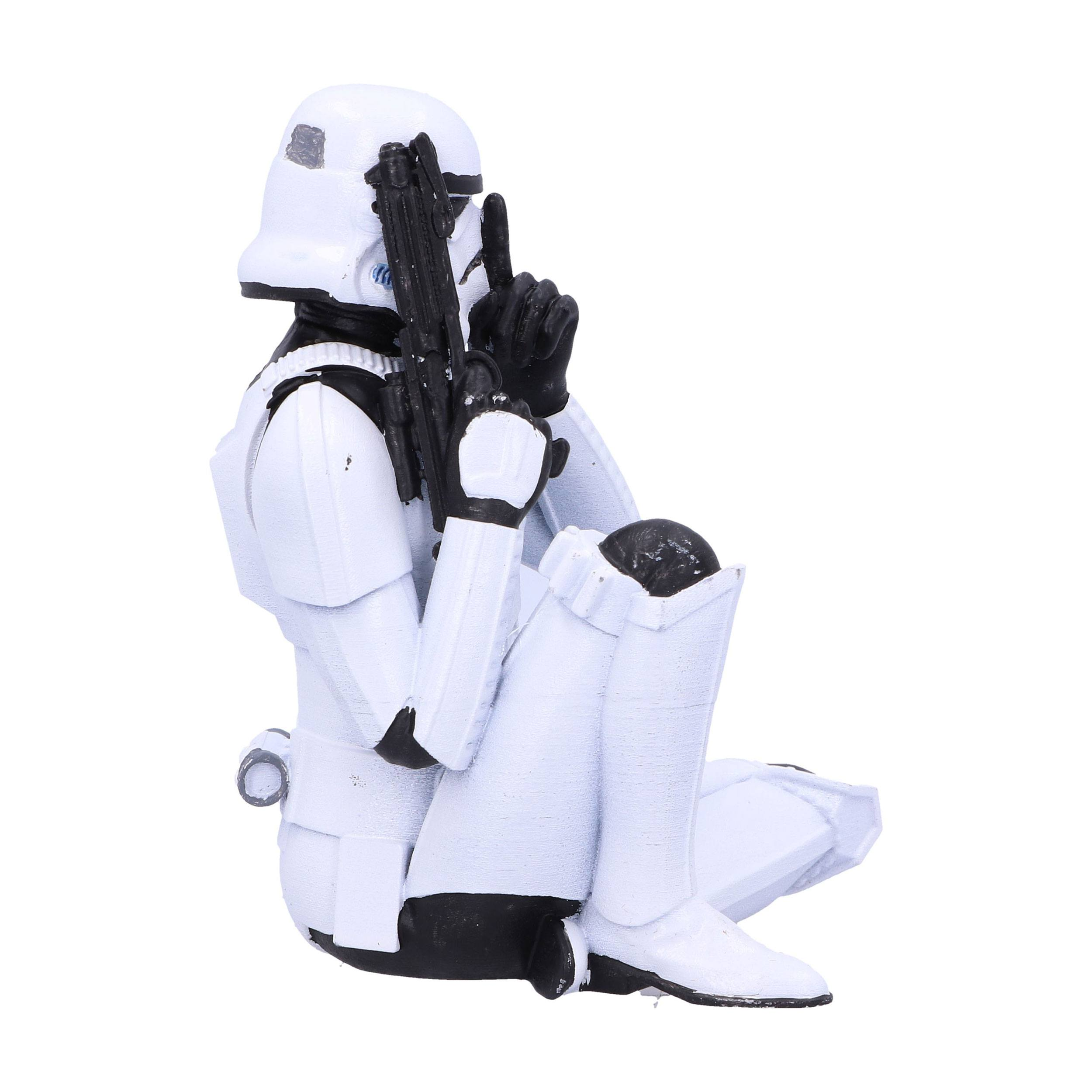 Eine Stormtrooper-Figur, kniend, hält einen Blaster und signalisiert Stille. Weiße Uniform, schwarze Akzente und weißer Hintergrund.