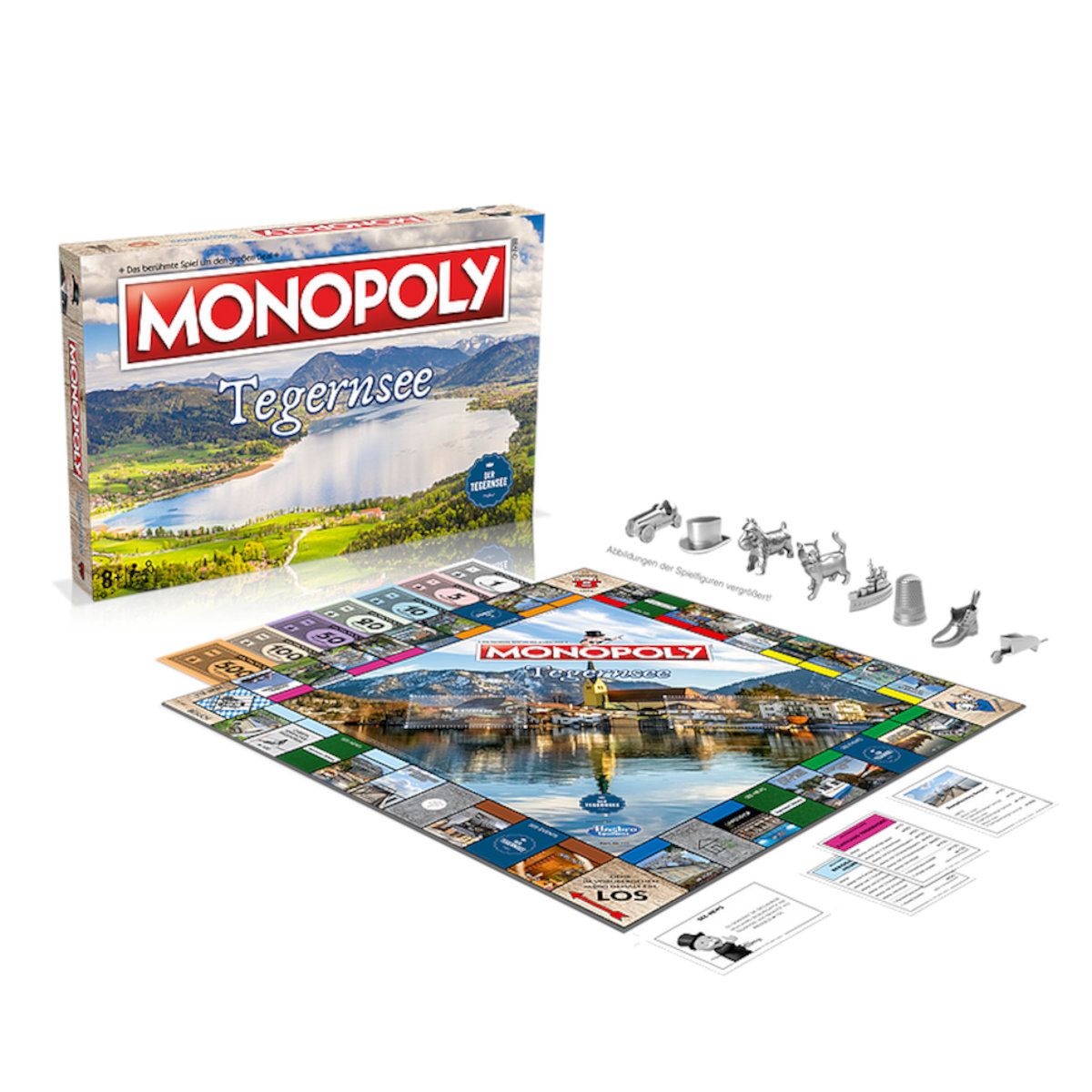 Monopoly-Brettspiel-Set, mit Spielbrett, Figuren und Schachtel. Weißer Hintergrund.
