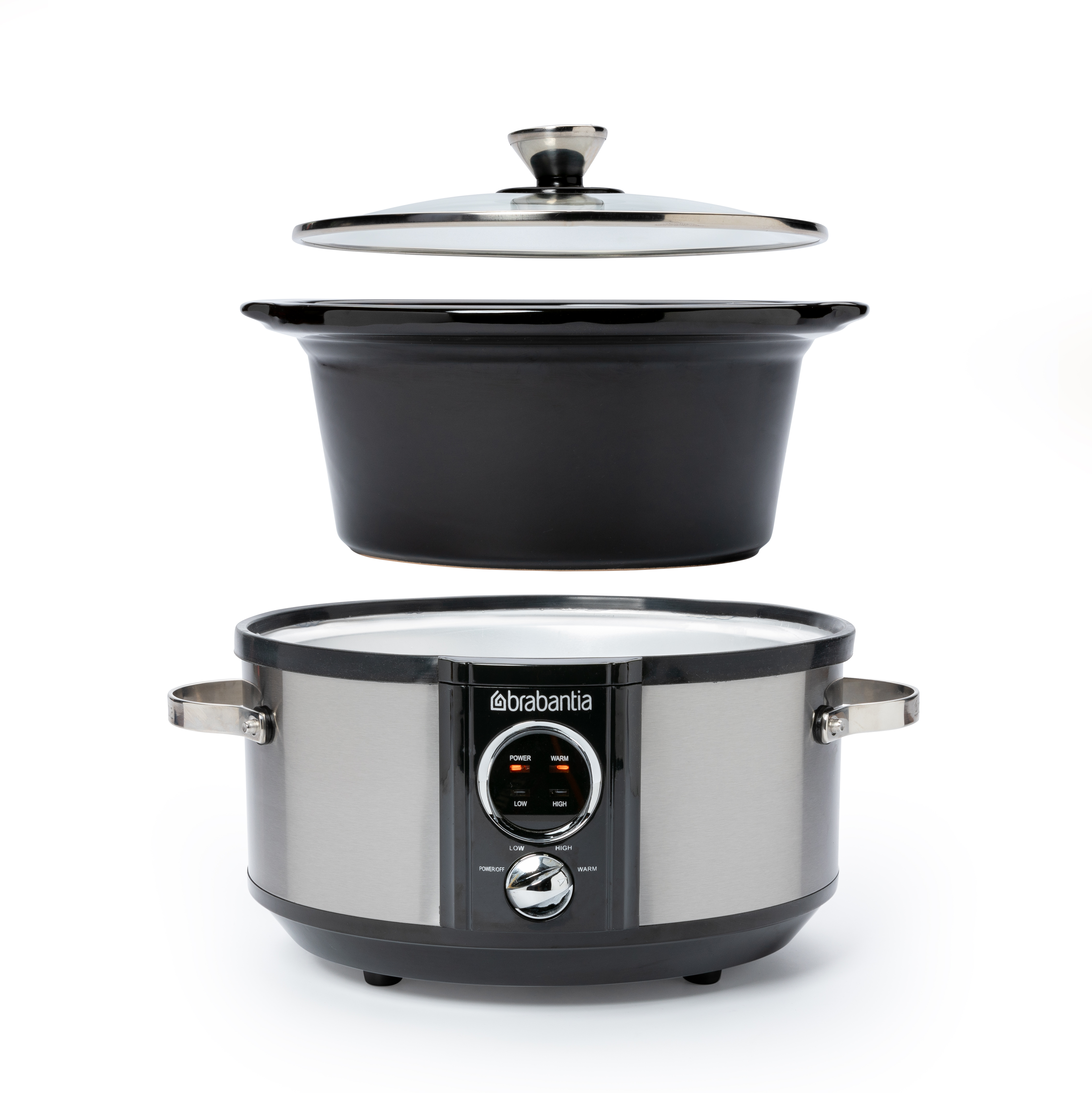 Brabantia Slow Cooker, mit offenem Deckel, oberer Teil entfernt. Silberne Basis und schwarzer Innentopf.