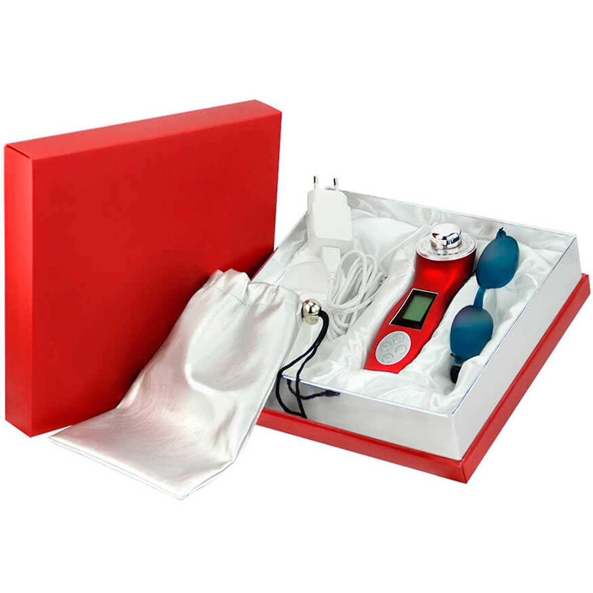 Caja roja con dispositivo de belleza y accesorios. Satén blanco y fondo blanco.