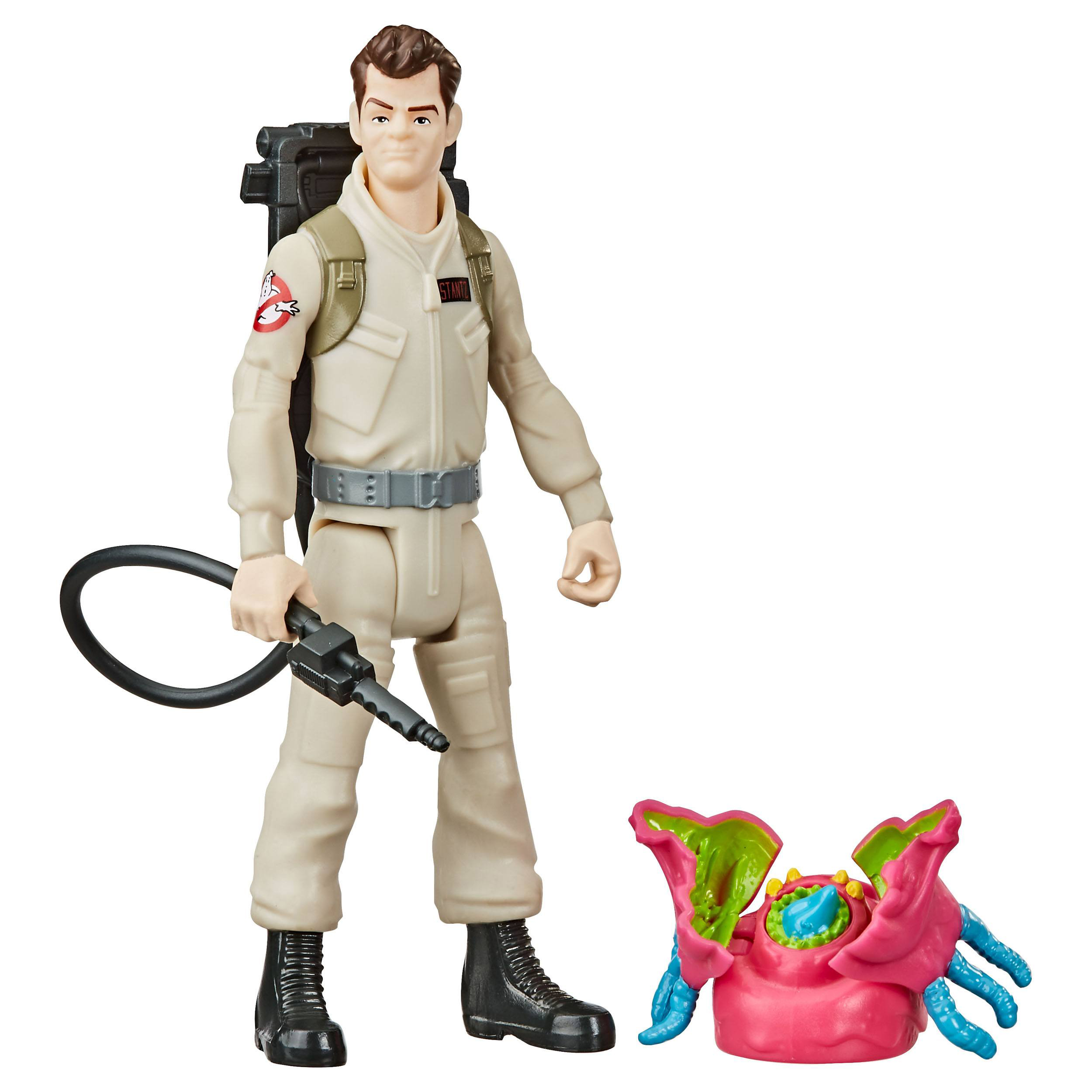Eine Ghostbuster-Actionfigur, die eine Waffe hält, und ein rosa Monster, das auf dem Boden liegt.
