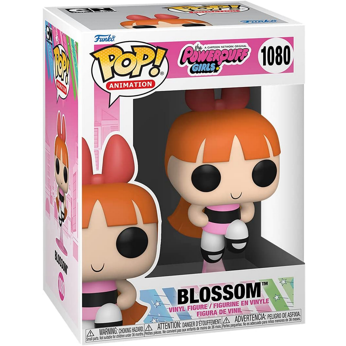 Blossom-Actionfigur in einer Box. Sie hat orangefarbene Haare, eine rosa Schleife und ein rosa-schwarzes Outfit.