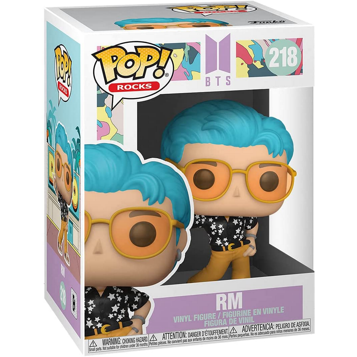 Scatola con statuetta BTS RM. Ha capelli blu, occhiali arancioni, camicia nera e pantaloni gialli.