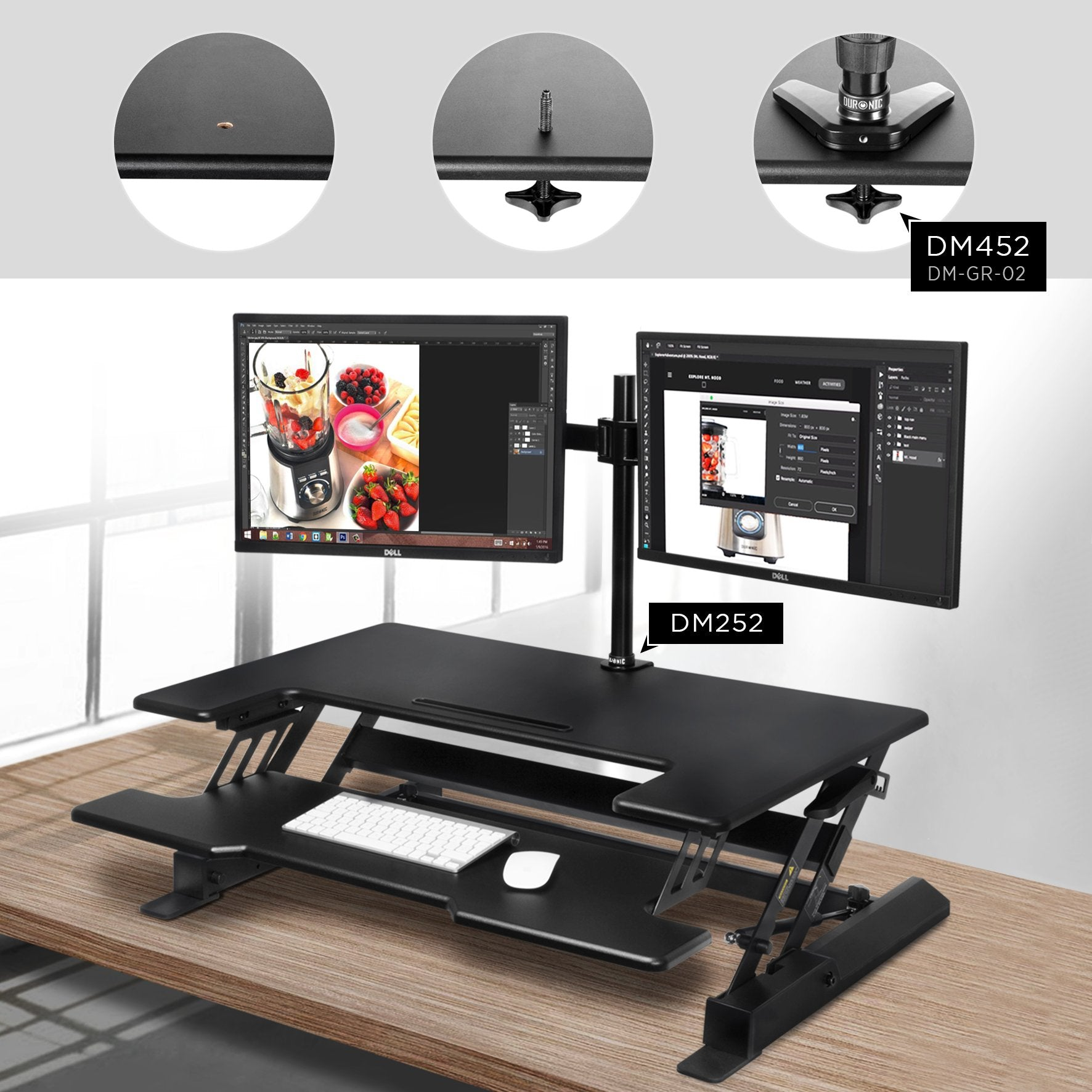 Ein schwarzer Schreibtisch mit zwei Monitoren. Eine Tastatur und Maus liegen auf dem Schreibtisch. Details des Schreibtischs gezeigt.