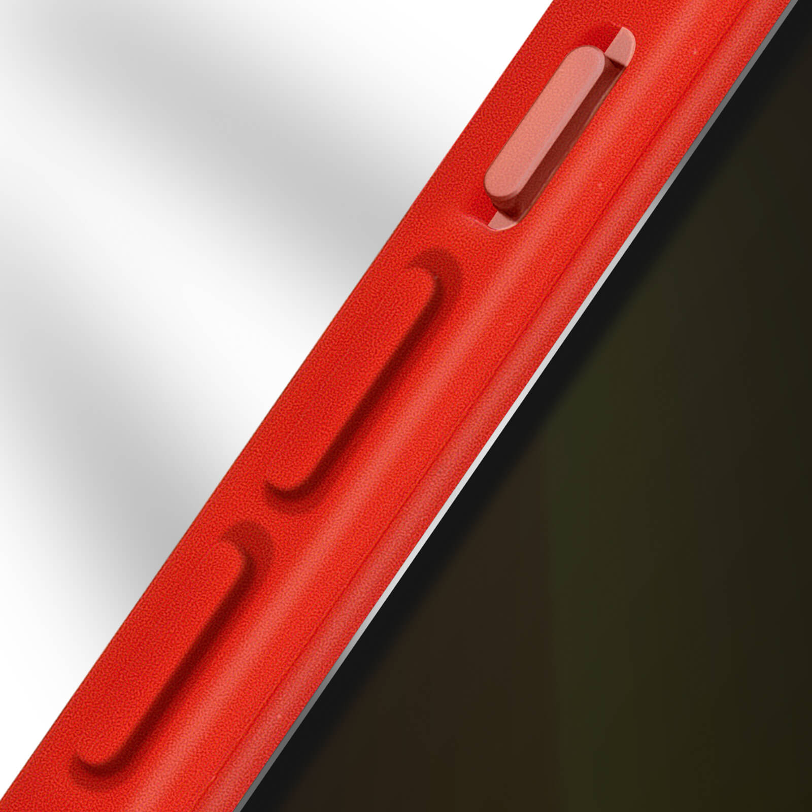 Gros plan sur une coque de téléphone rouge avec des boutons de volume et un bouton d'alimentation.