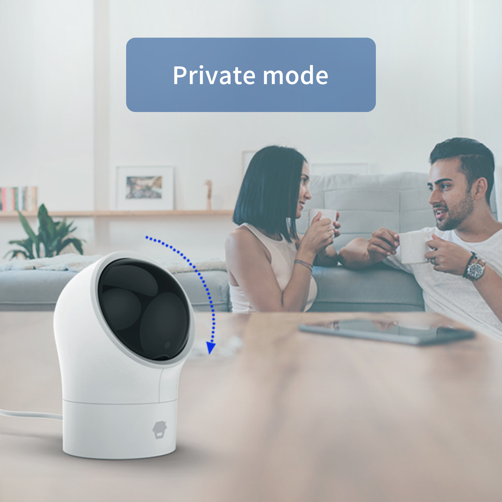Una telecamera su un tavolo, con una coppia che parla sullo sfondo, e il testo 'Modalità privata'.
