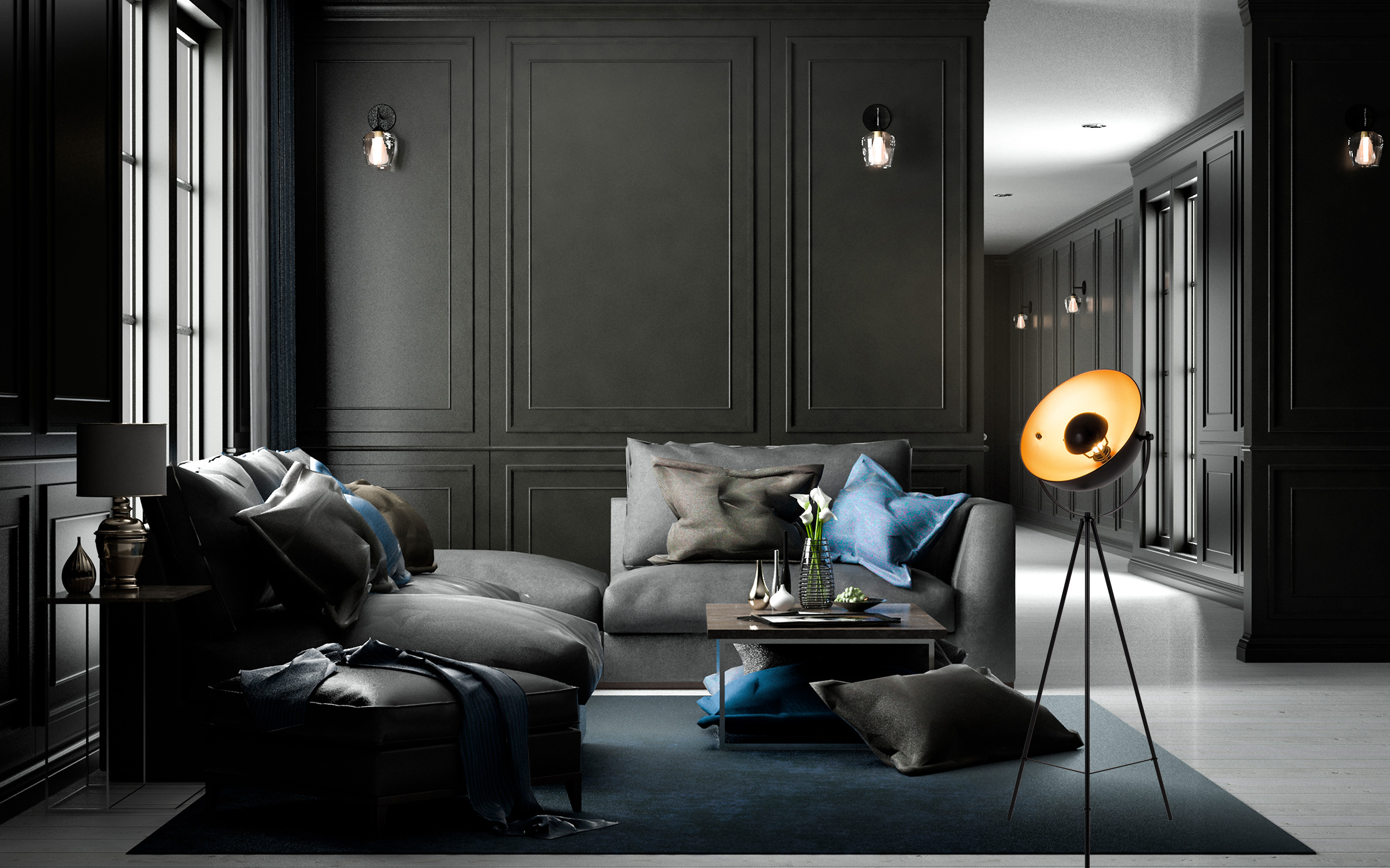 Ein modernes Wohnzimmer mit dunkelgrauen Wänden, einem grauen Sofa und einer Stehlampe. Es gibt einen Teppich.