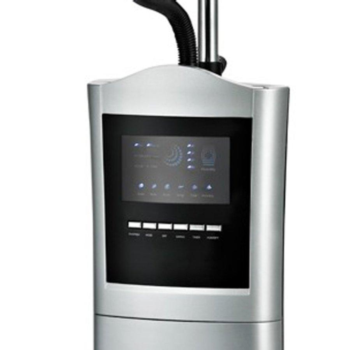 Zbliżenie srebrnego urządzenia z czarnym ekranem, pokazujące interfejs i przyciski.