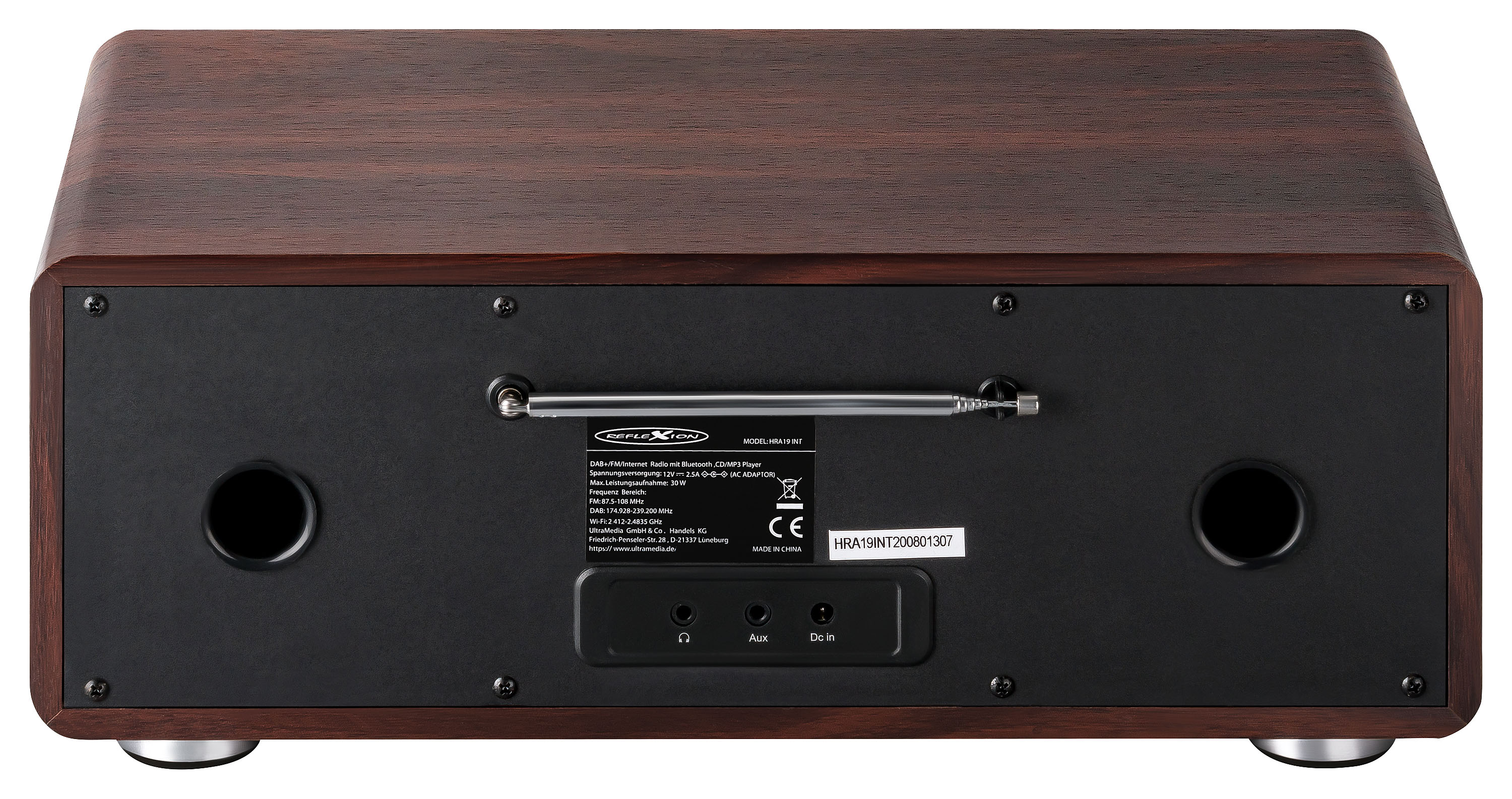 Il retro di una radio stereo in legno con antenna metallica e pulsanti.