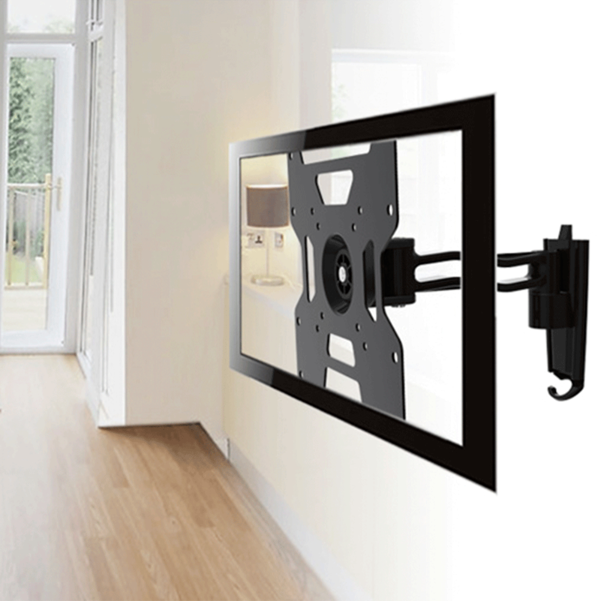 Un televisor negro montado en una pared blanca con piso de madera y lámpara detrás.