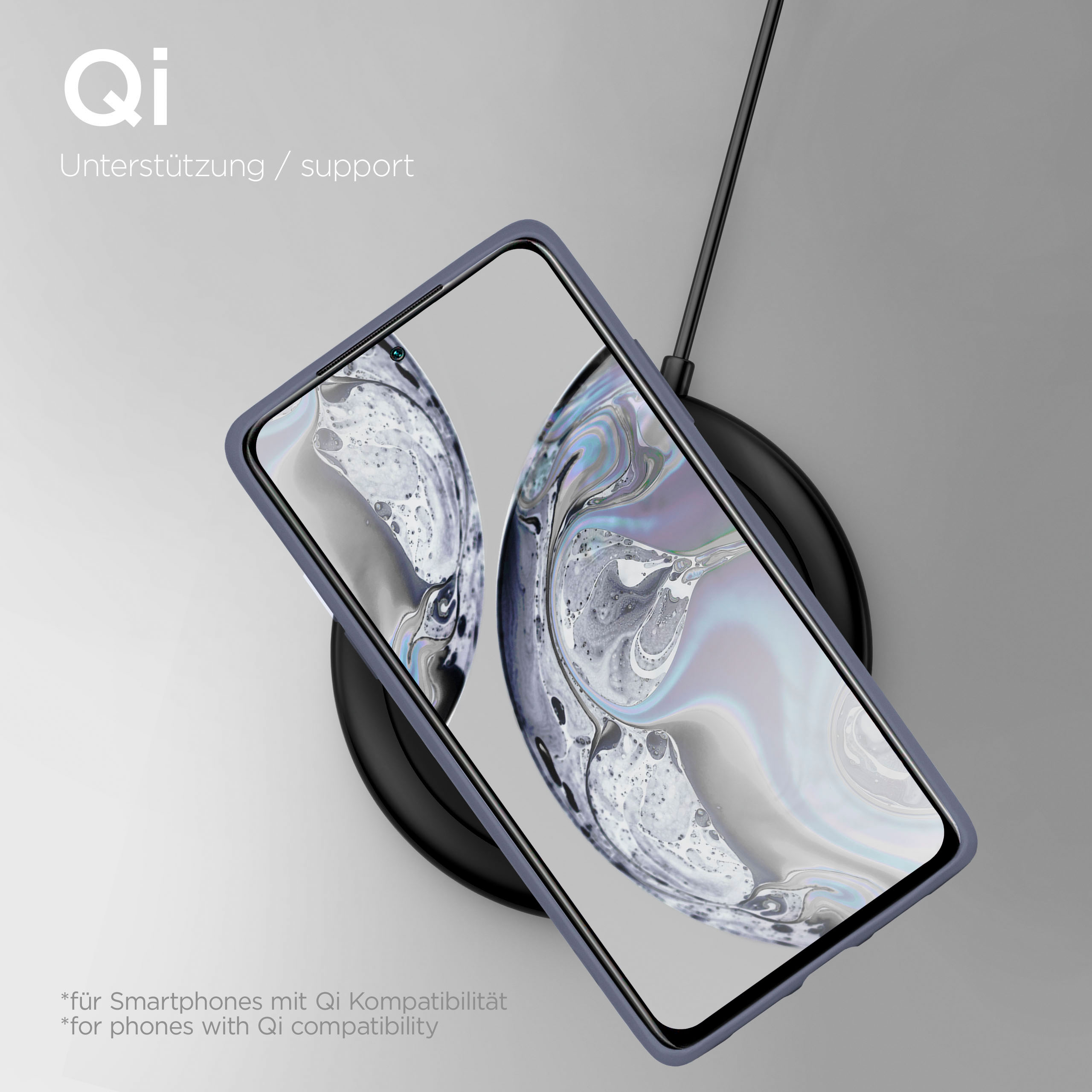 Ein Smartphone lädt auf einer schwarzen Qi-Ladestation, mit Text.