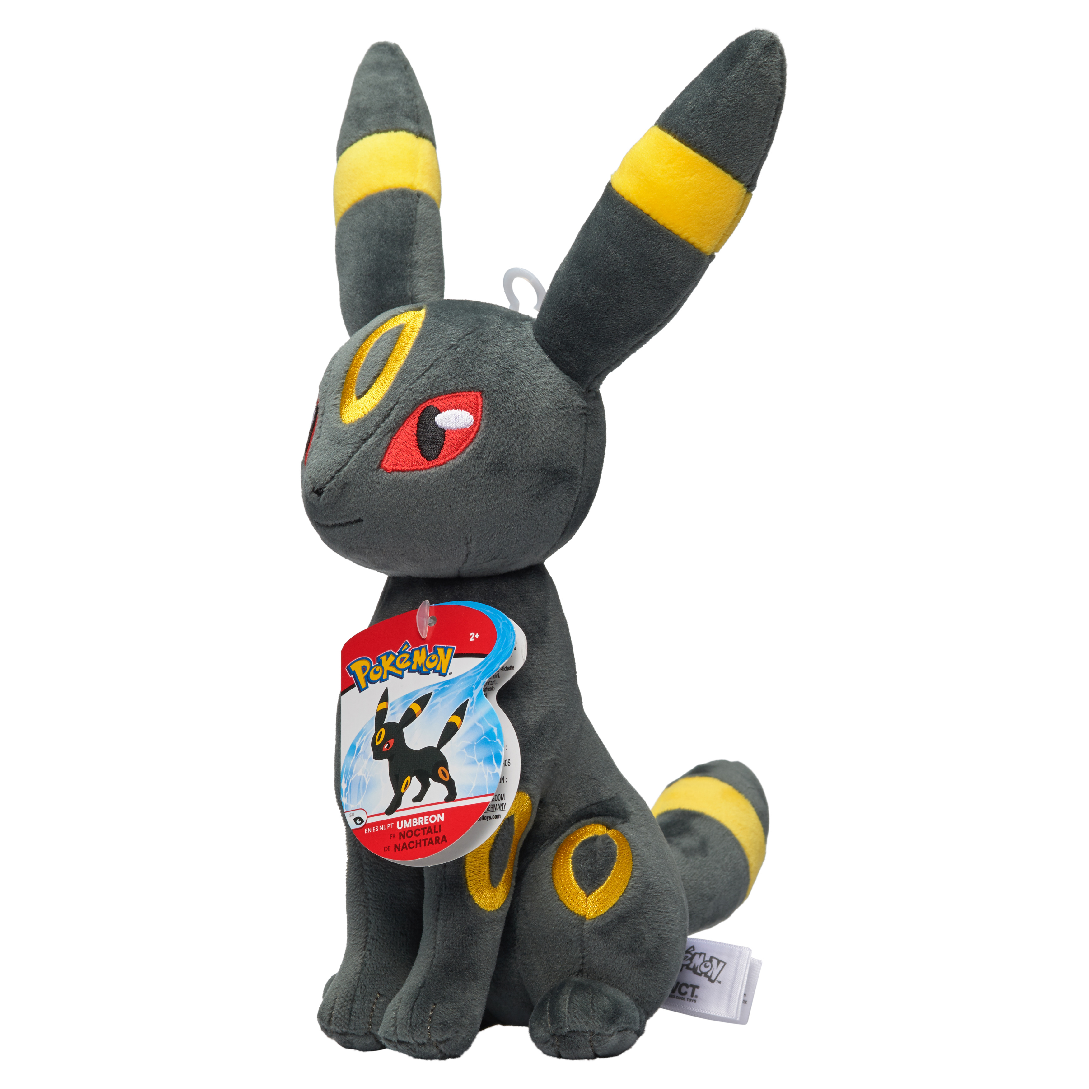 Umbreon-Plüschtier mit Etikett. Es ist schwarz mit gelben Markierungen, sitzt auf weißem Untergrund.