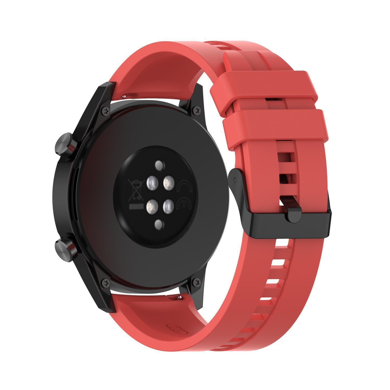 Eine schwarze Smartwatch mit rotem Armband, auf weißem Hintergrund.