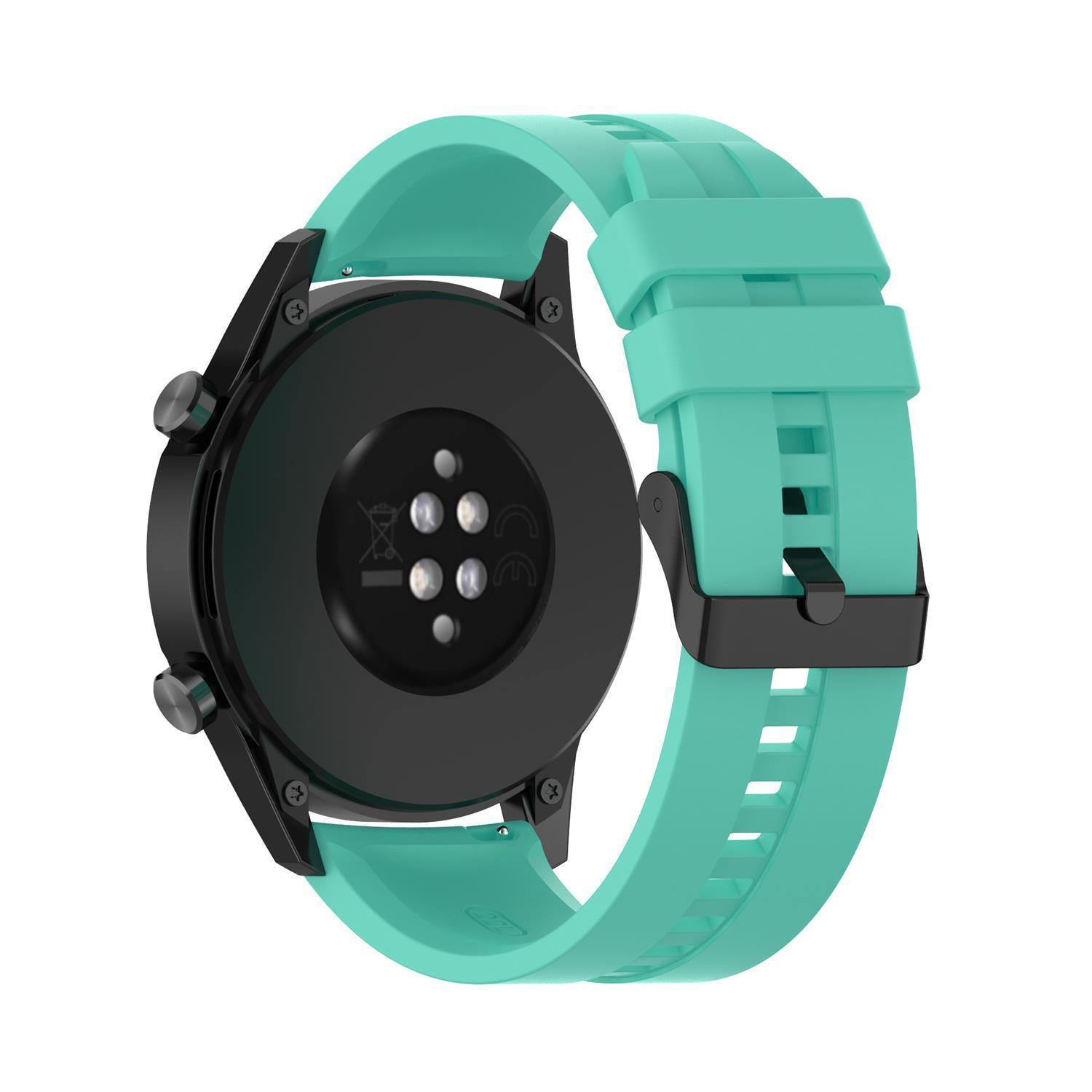 Eine Uhr mit schwarzem Gehäuse und türkisfarbenem Armband. Die Uhr wird von hinten betrachtet.