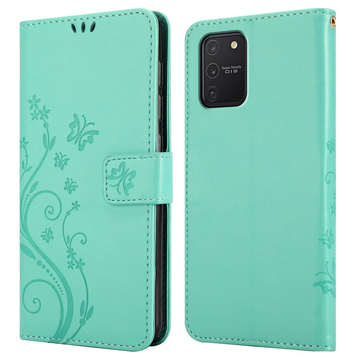 Custodia per telefono verde menta, decorata con un design floreale e a farfalla. Ha una chiusura magnetica.