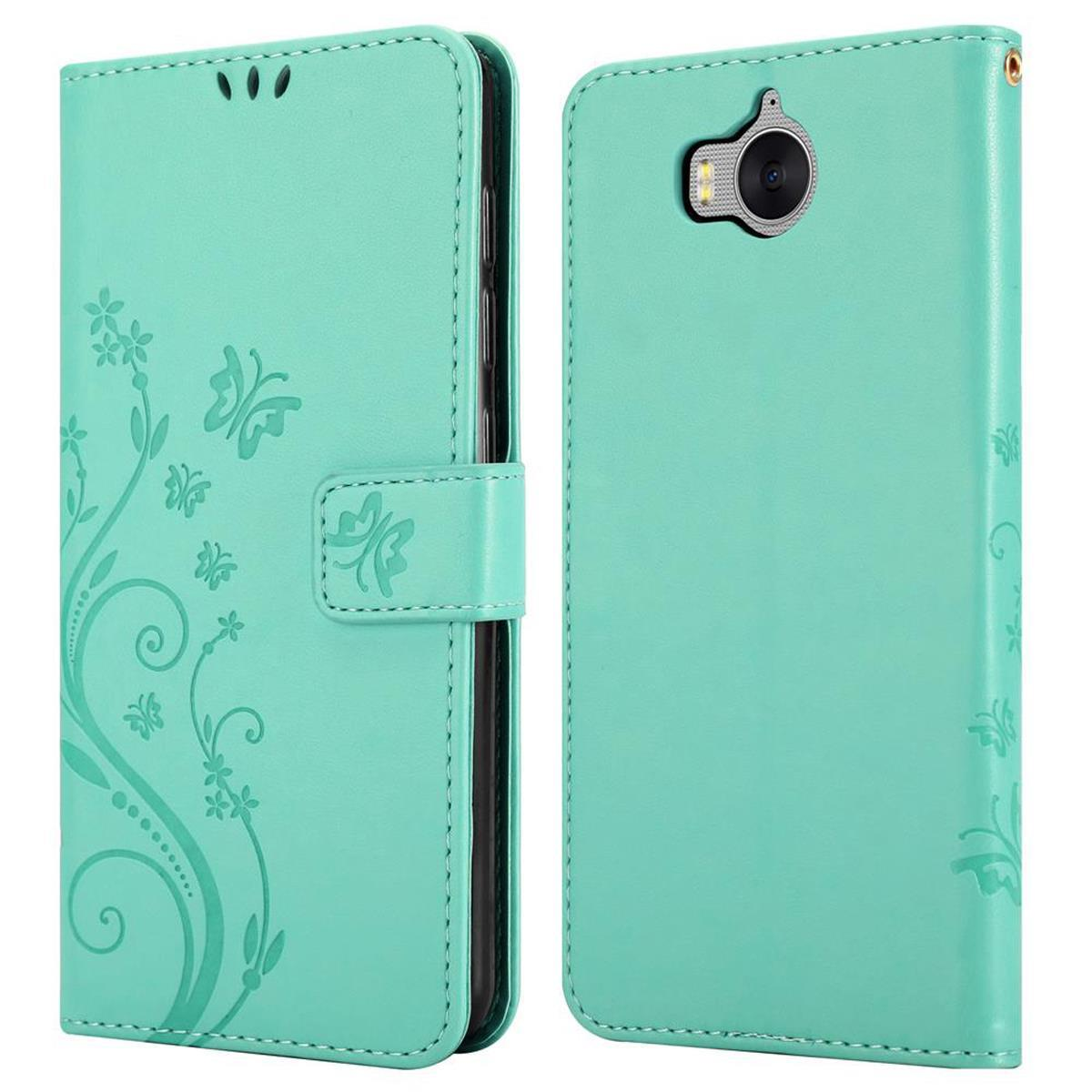 Custodia per telefono verde menta, chiusa e aperta. Design a farfalla sul davanti e foro per la fotocamera.
