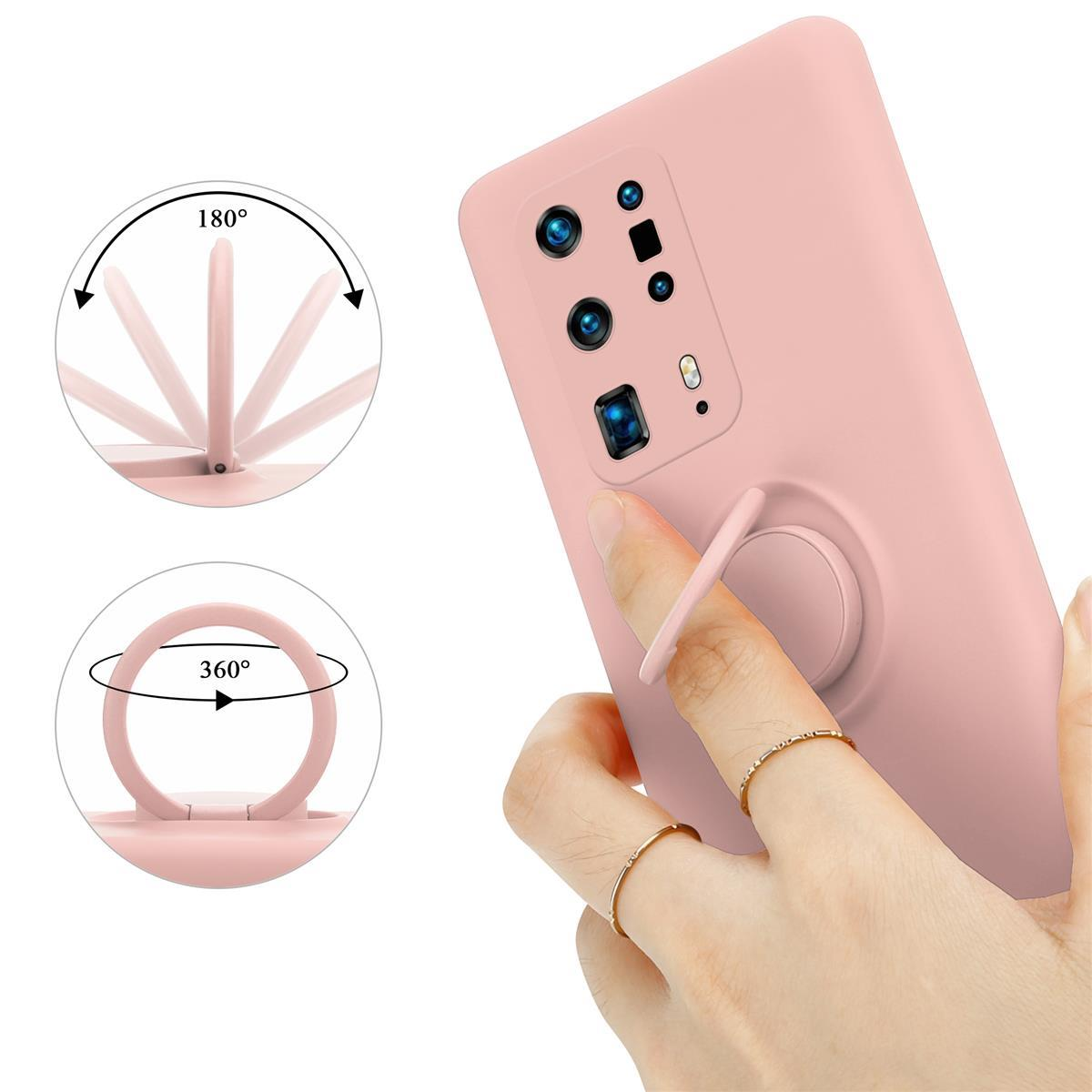 Telefono rosa con supporto ad anello, viste rotanti dell'anello. Una mano che tiene il telefono.