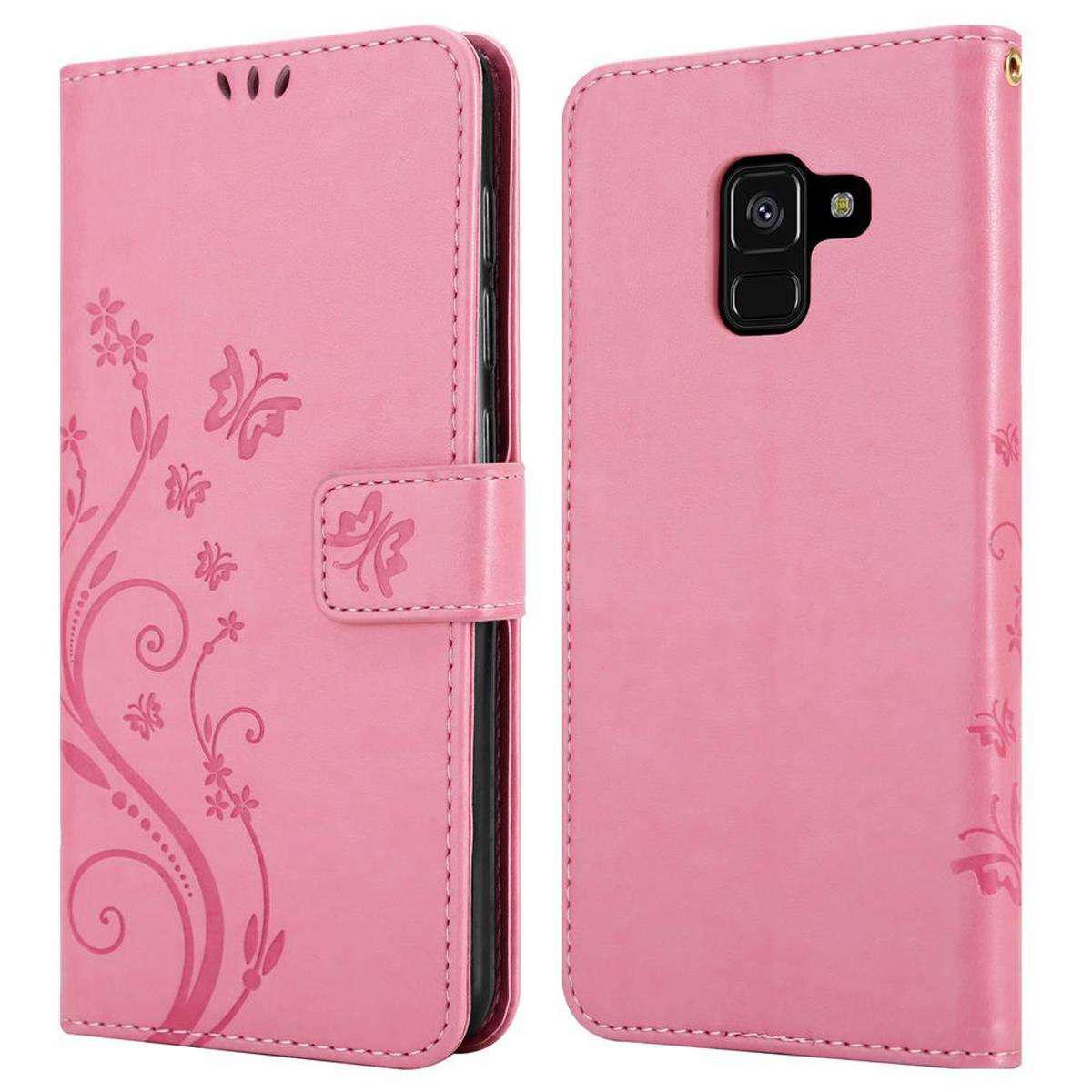 Custodia per telefono rosa, chiusa e aperta, con design floreale e chiusura magnetica.