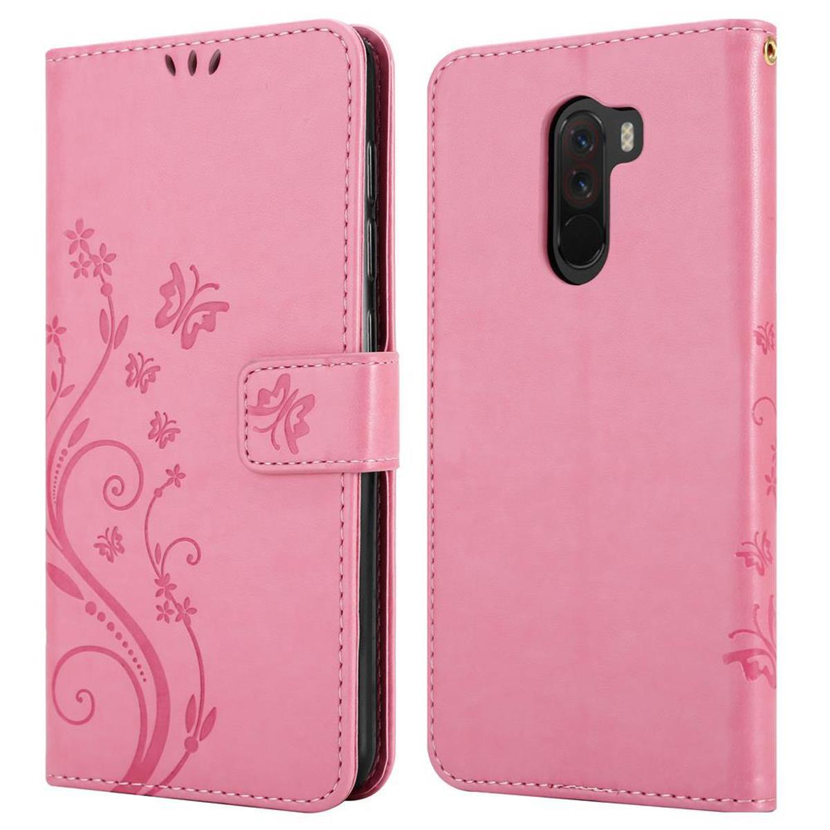 Custodia rosa per telefono con design floreale, aperta per mostrare telefono e fessure per carte.
