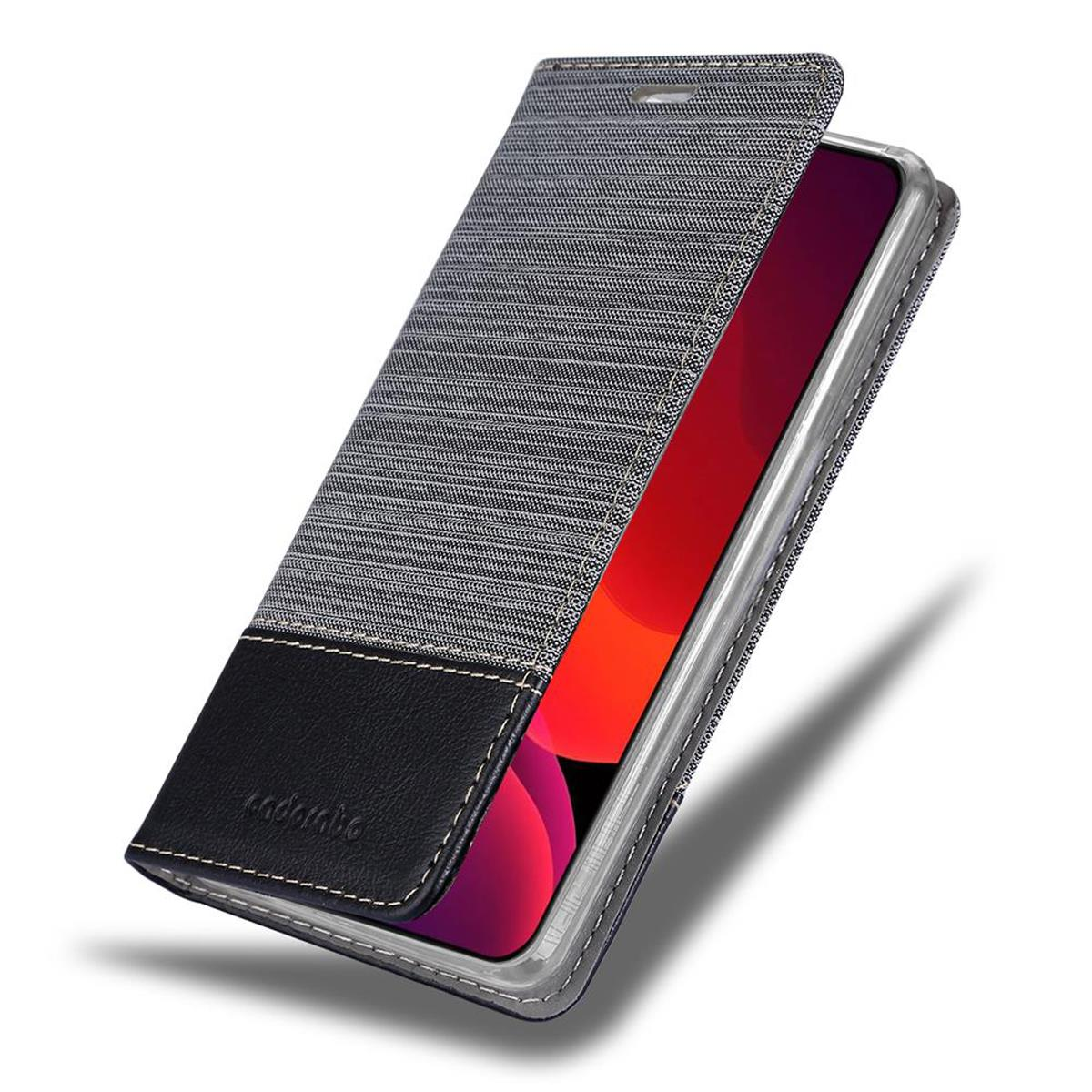 Jeans-Handyhülle mit schwarzem Lederboden. Das Telefon ist im Inneren der Hülle sichtbar.