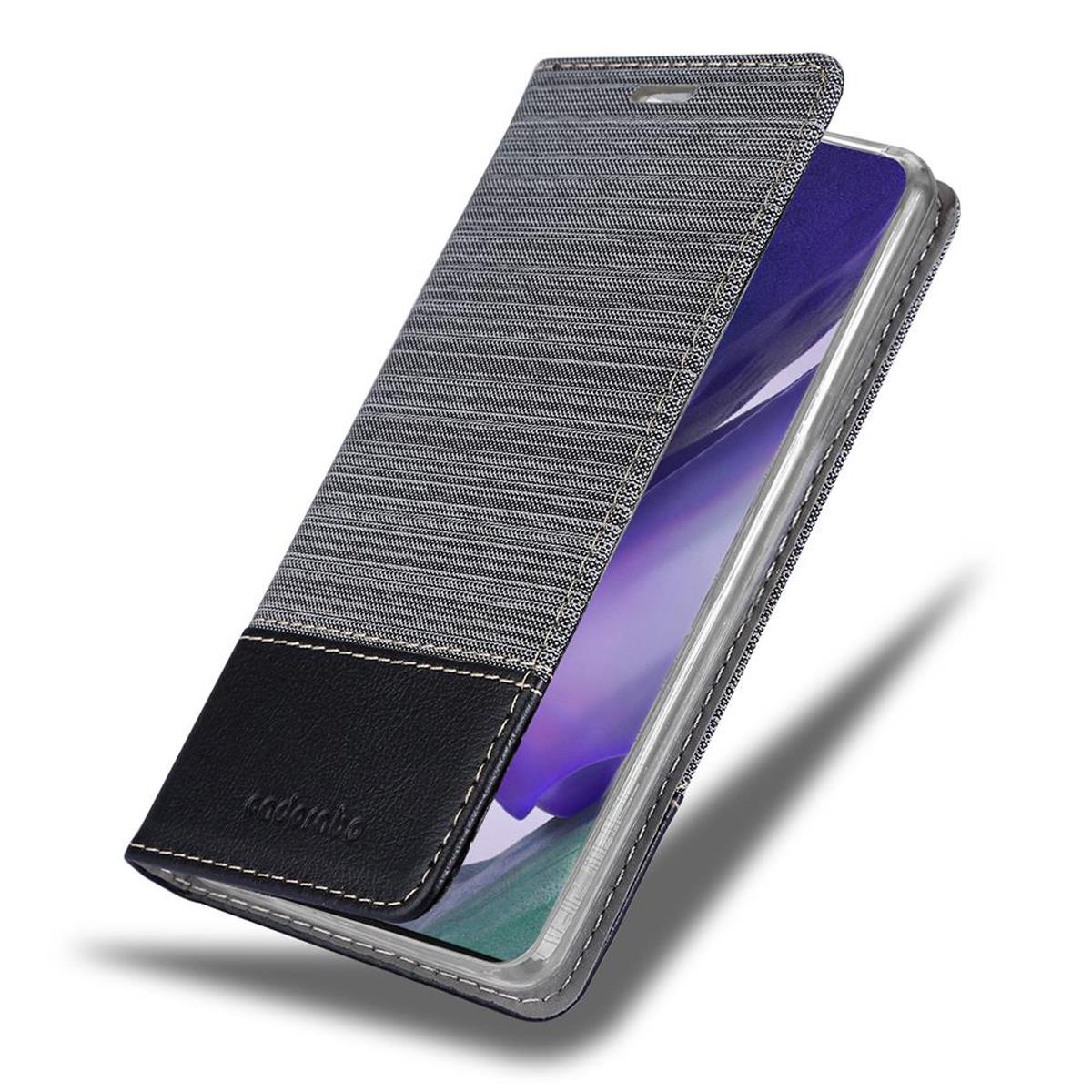 Handyhülle, offen. Grauer Denim und schwarzes Leder. Innenraum, Telefon.