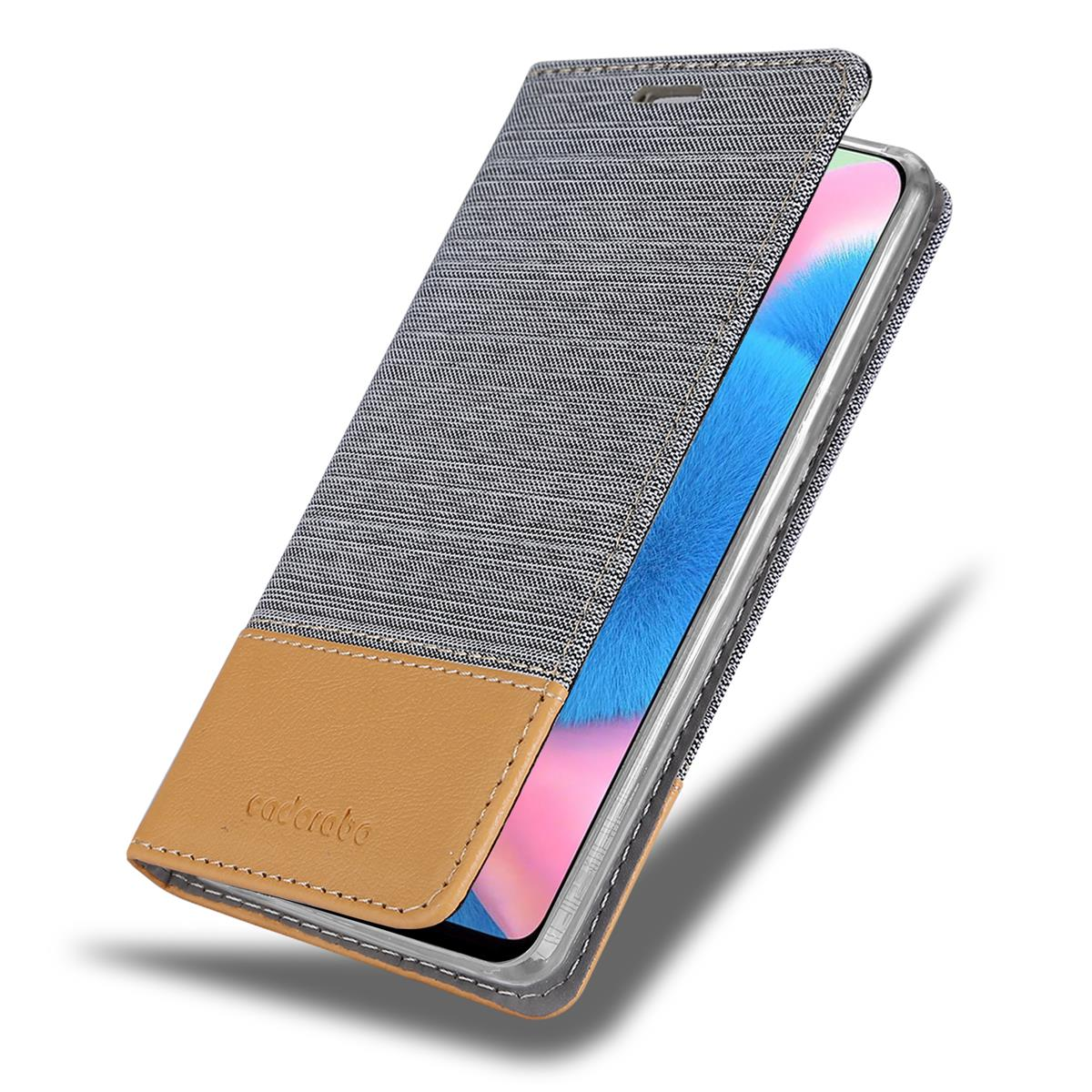 Handyhülle mit braun-grauem Cover und Telefon mit blau-rosa Bildschirm, offen.