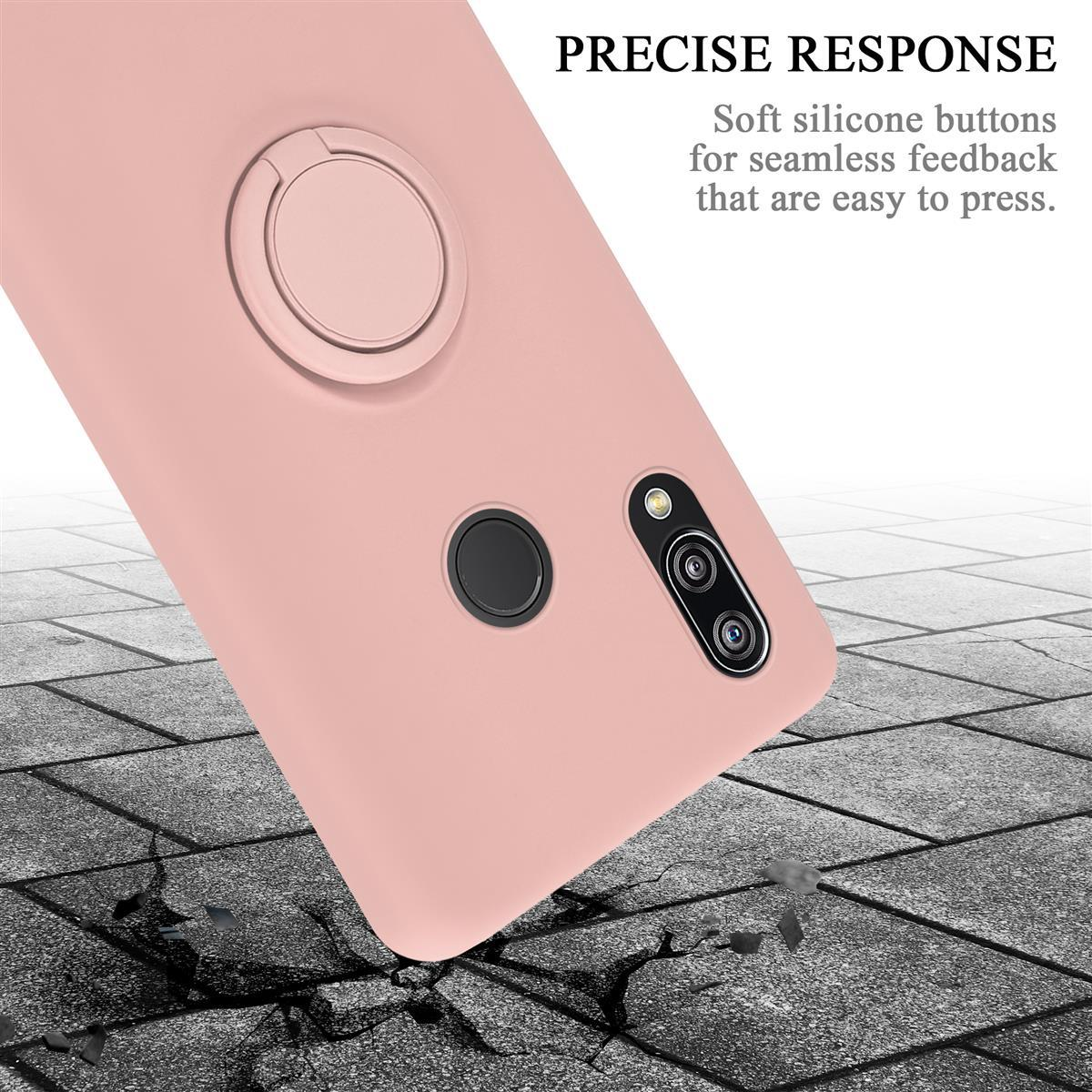 Custodia per telefono rosa con supporto ad anello e fotocamera. La custodia è su una superficie strutturata con ombre.